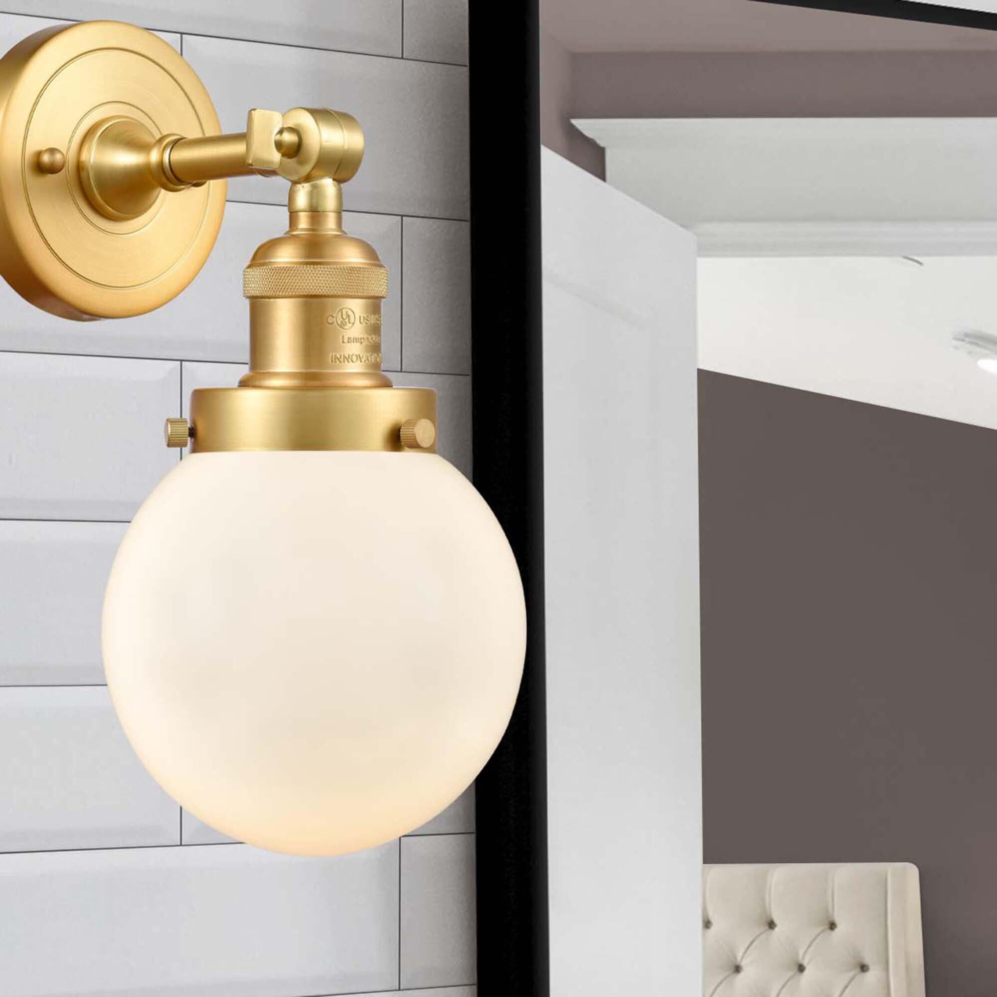 Shown in Satin Gold finish and Matte White Cased Beacon glass