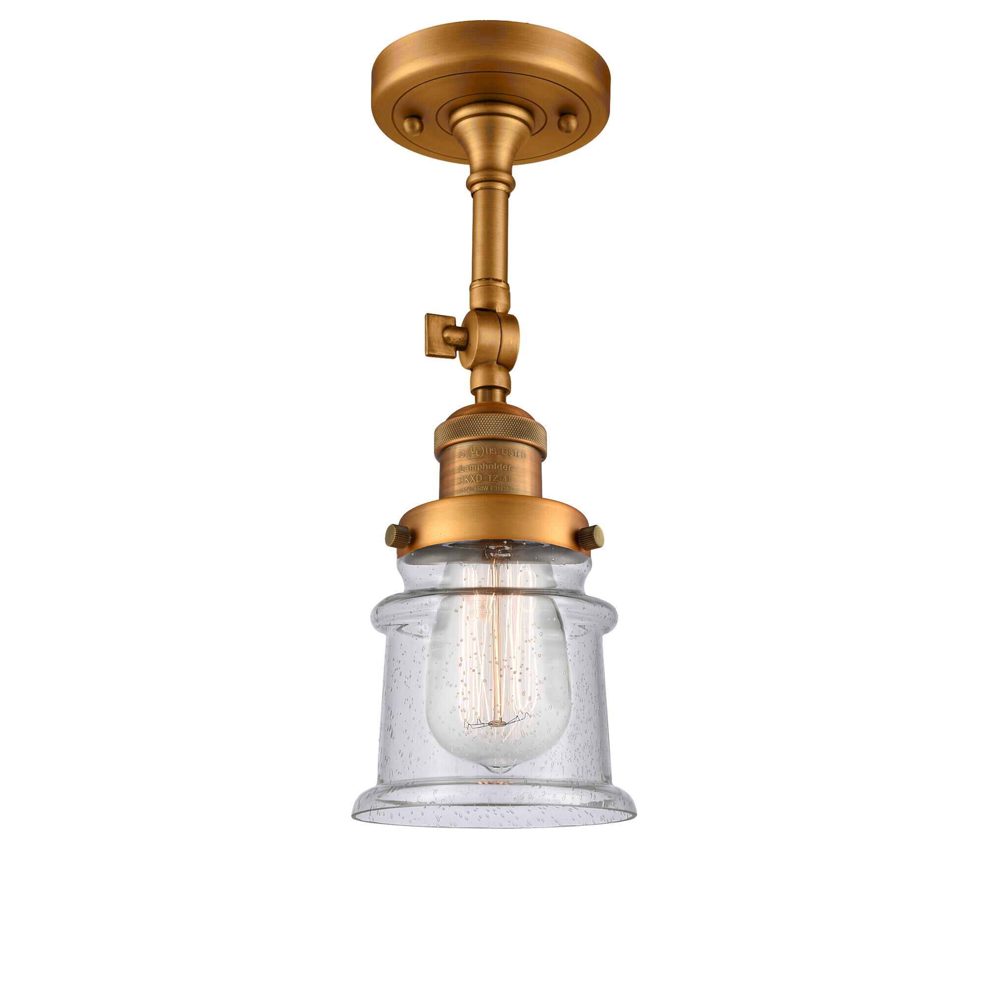 Shown in Brushed Brass finish and Seedy glass and None accent