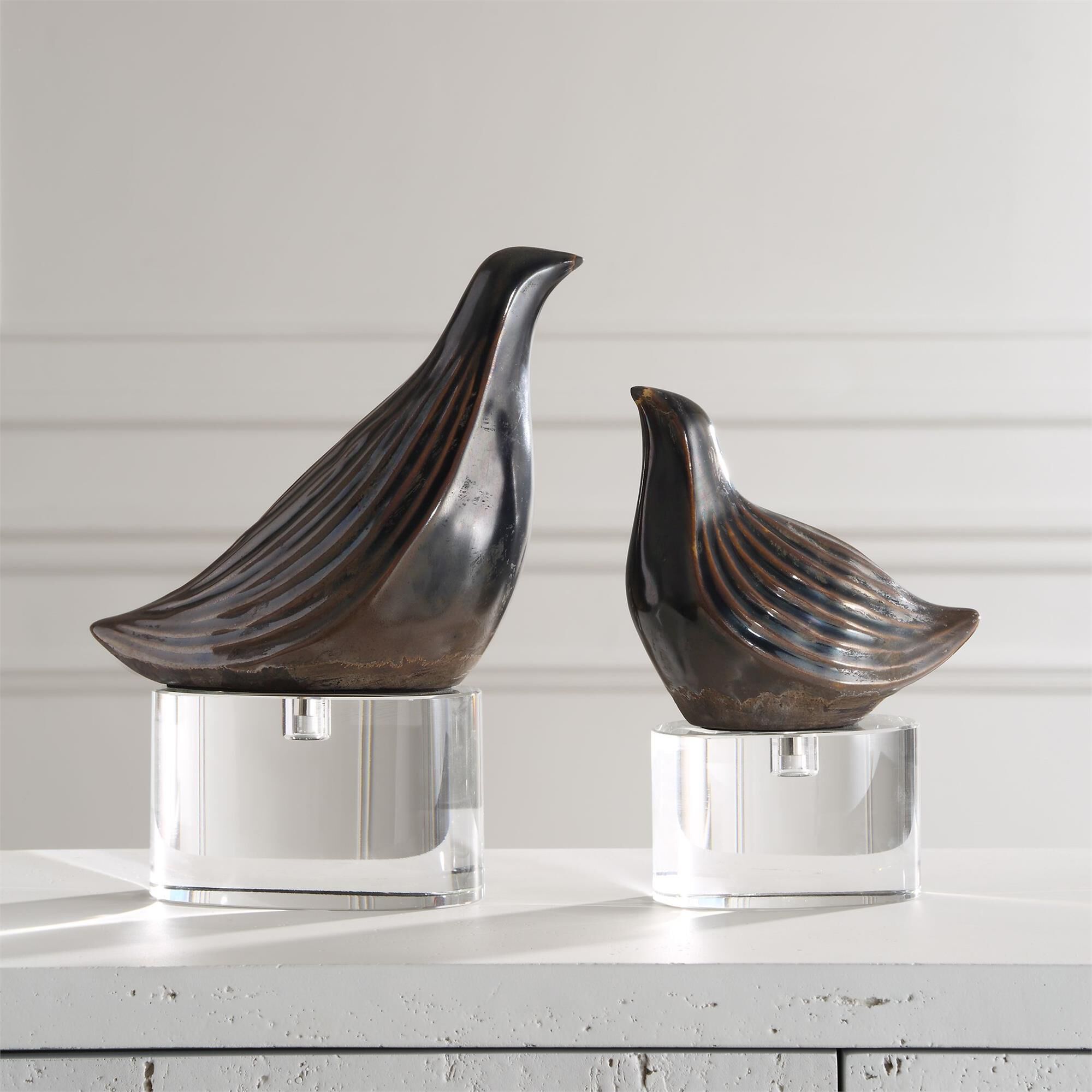 Shown in Bring A Touch Of Nature Indoors With Our Set Of Two Nesting Bird Sculptures. The Gunmetal Gray Finis finish