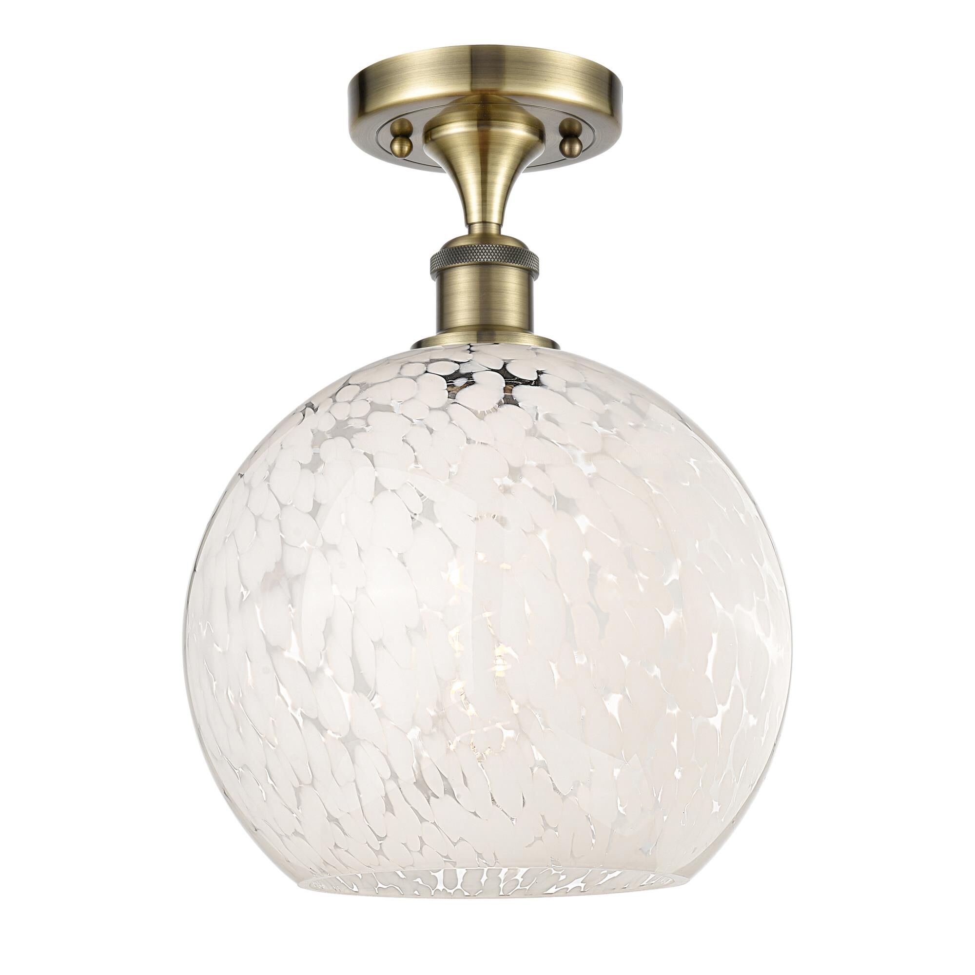 Shown in Antique Brass finish and White Mouchette glass