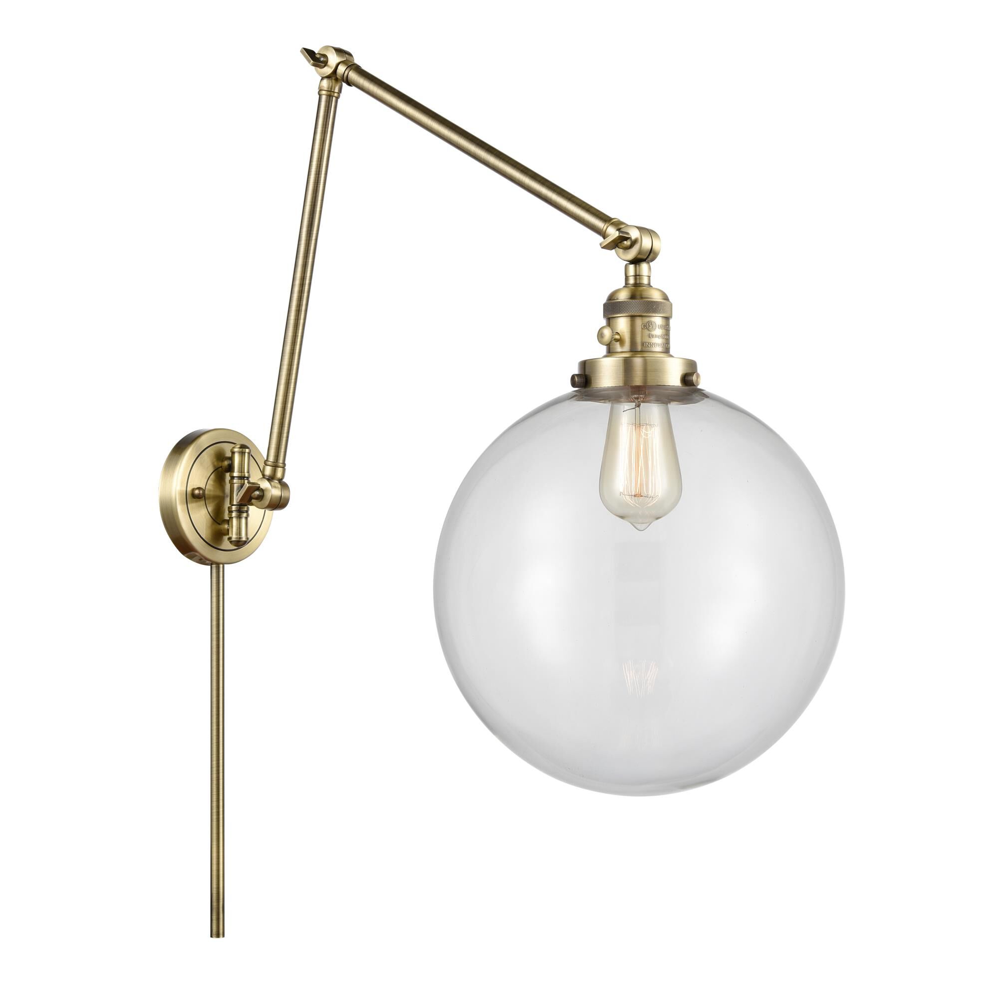 Shown in Antique Brass finish and Clear Beacon glass
