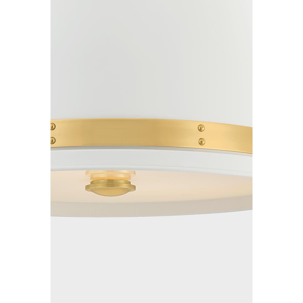 Shown in Aged Brass and Soft White finish and White glass