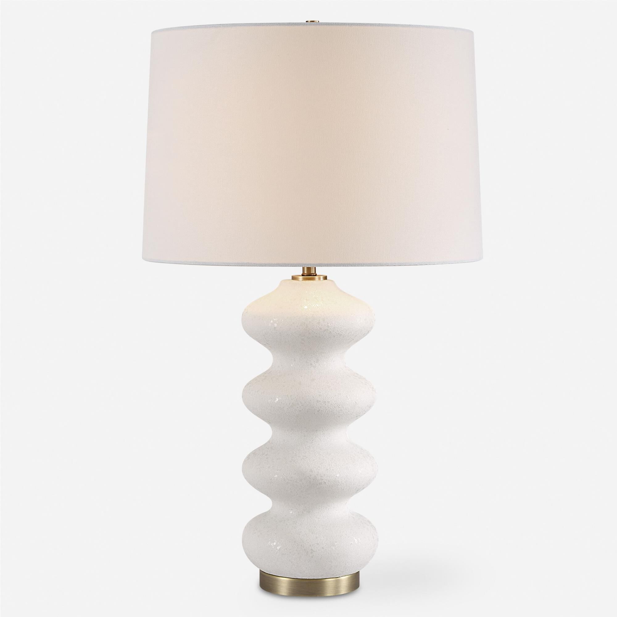 Shown in This Porcelain Lamp Exudes An Elegant Quality With Its Graceful Flowing Design And White Tone-On-Ton finish and Round Hardback shade