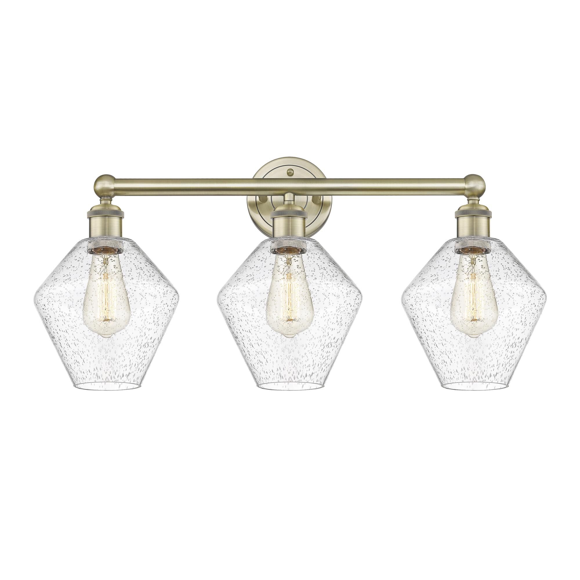 Shown in Antique Brass finish and Seedy glass