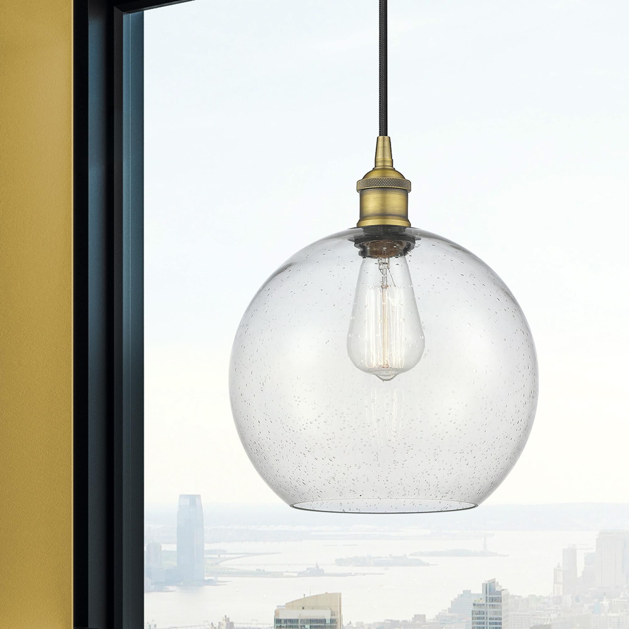 Shown in Brushed Brass finish and Seedy Large Athens glass