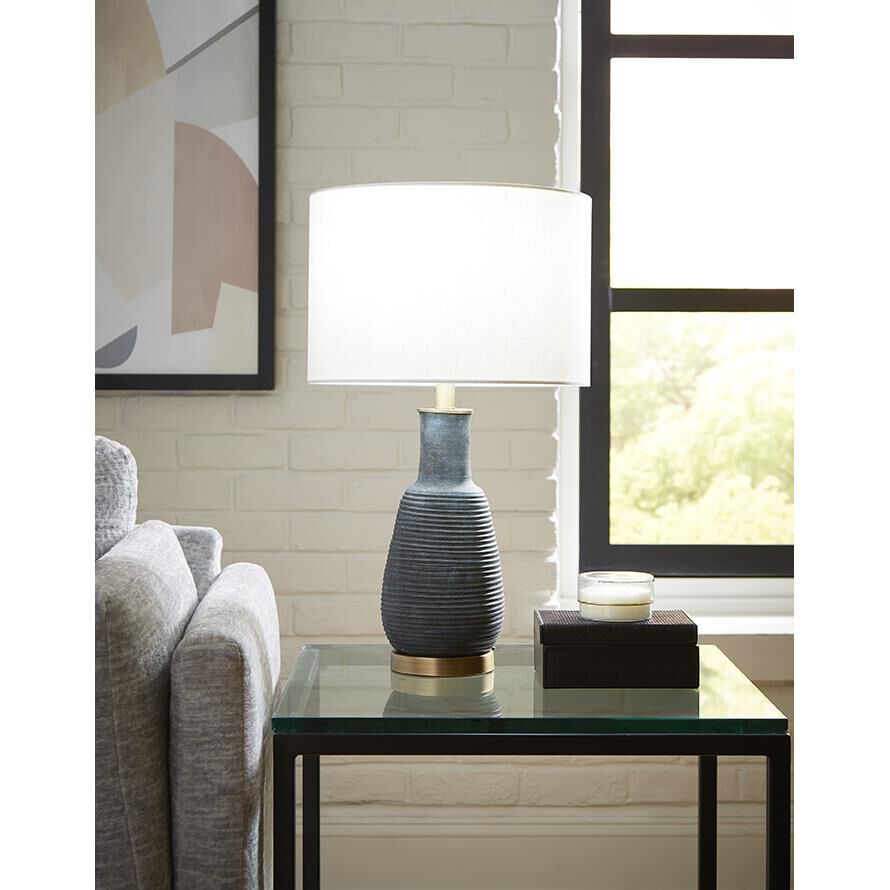 Shown in Brass finish and Seasalt glass and Seasalt Linen Drum shade