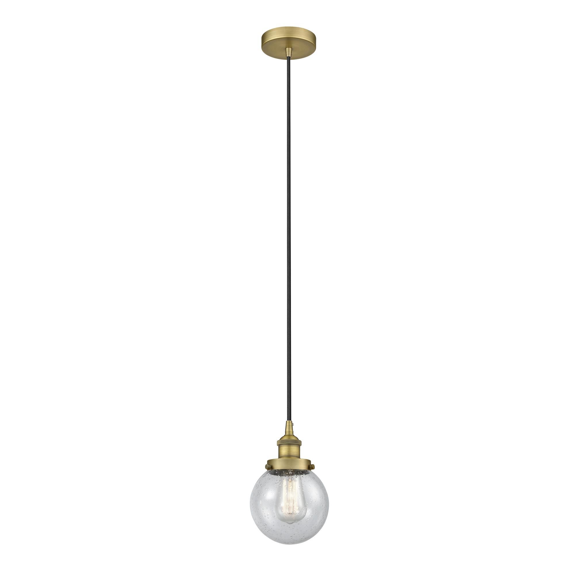 Shown in Brushed Brass finish and Seedy glass