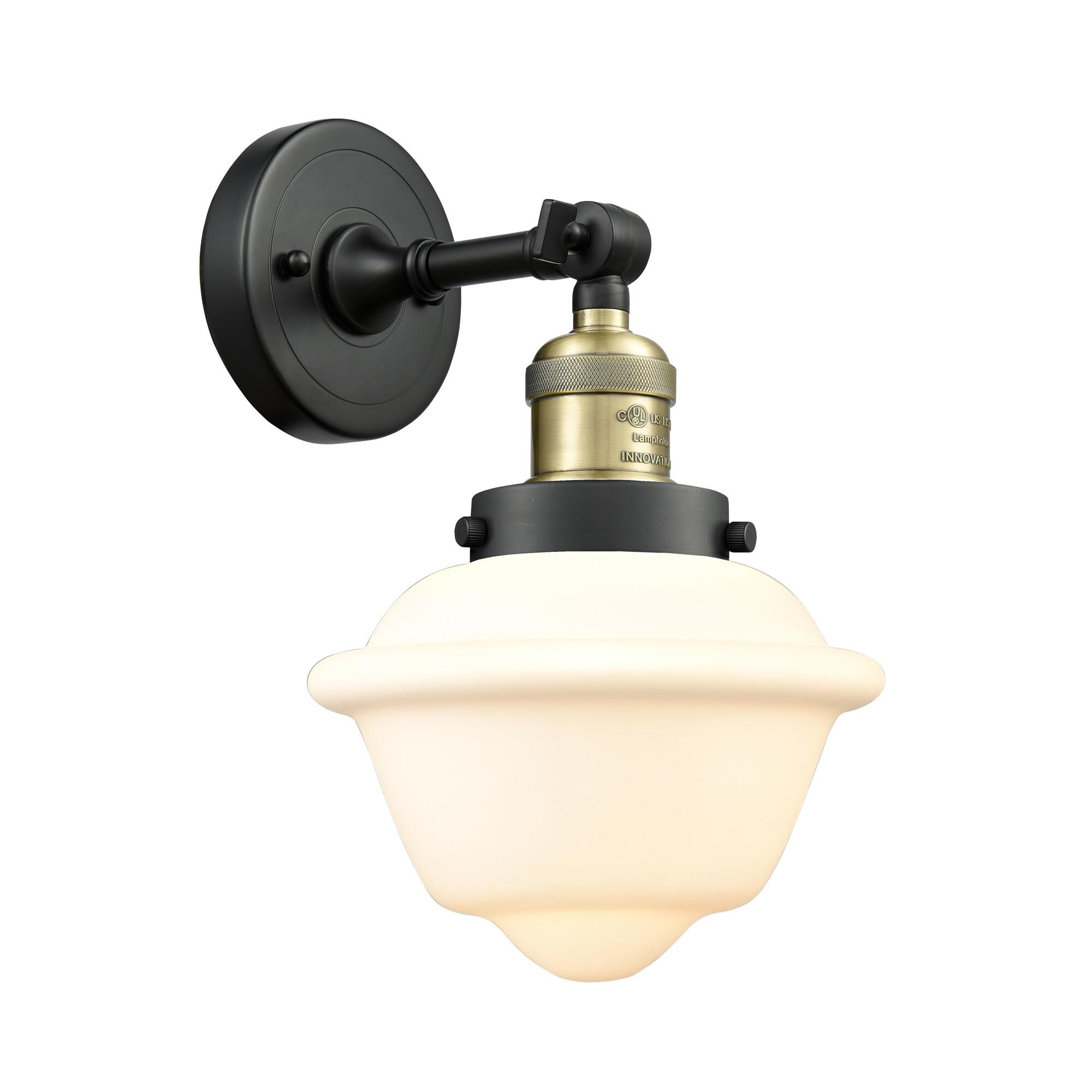 Shown in Black Antique Brass finish and Matte White Cased glass