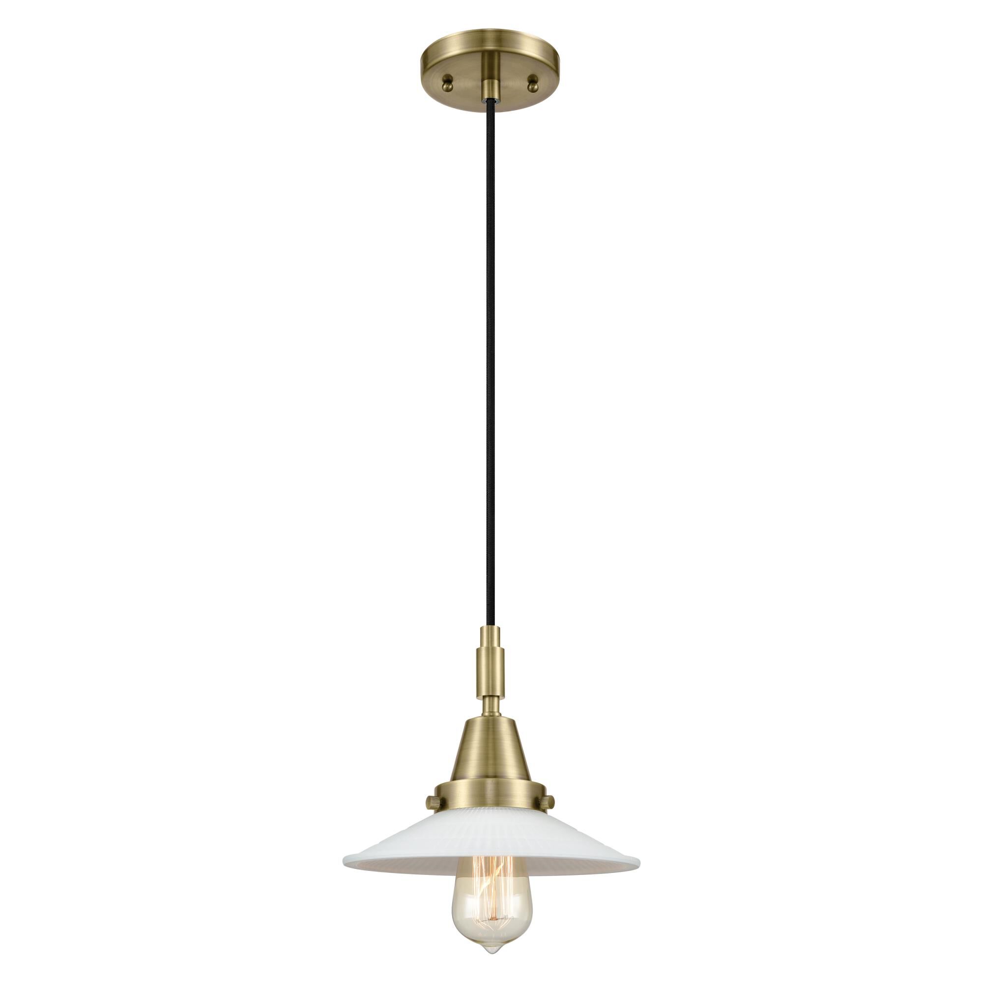 Shown in Antique Brass finish and Matte White Halophane glass