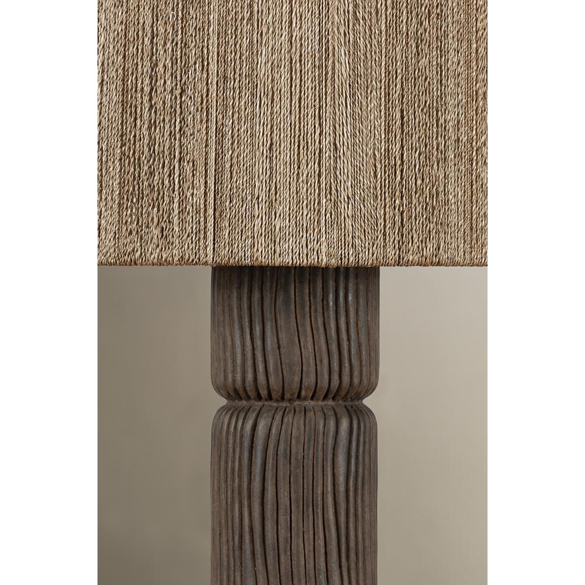 Shown in Patina Brass and Ceramic Shadowed Bark finish and Abaca shade