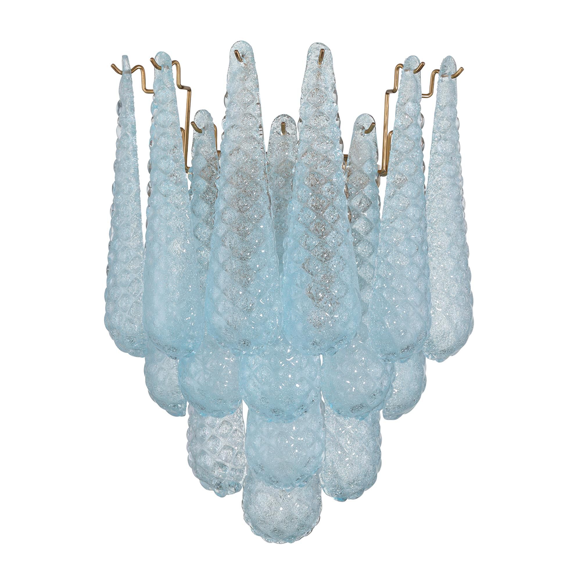 Shown in Aged Brass finish and Sand Blue glass