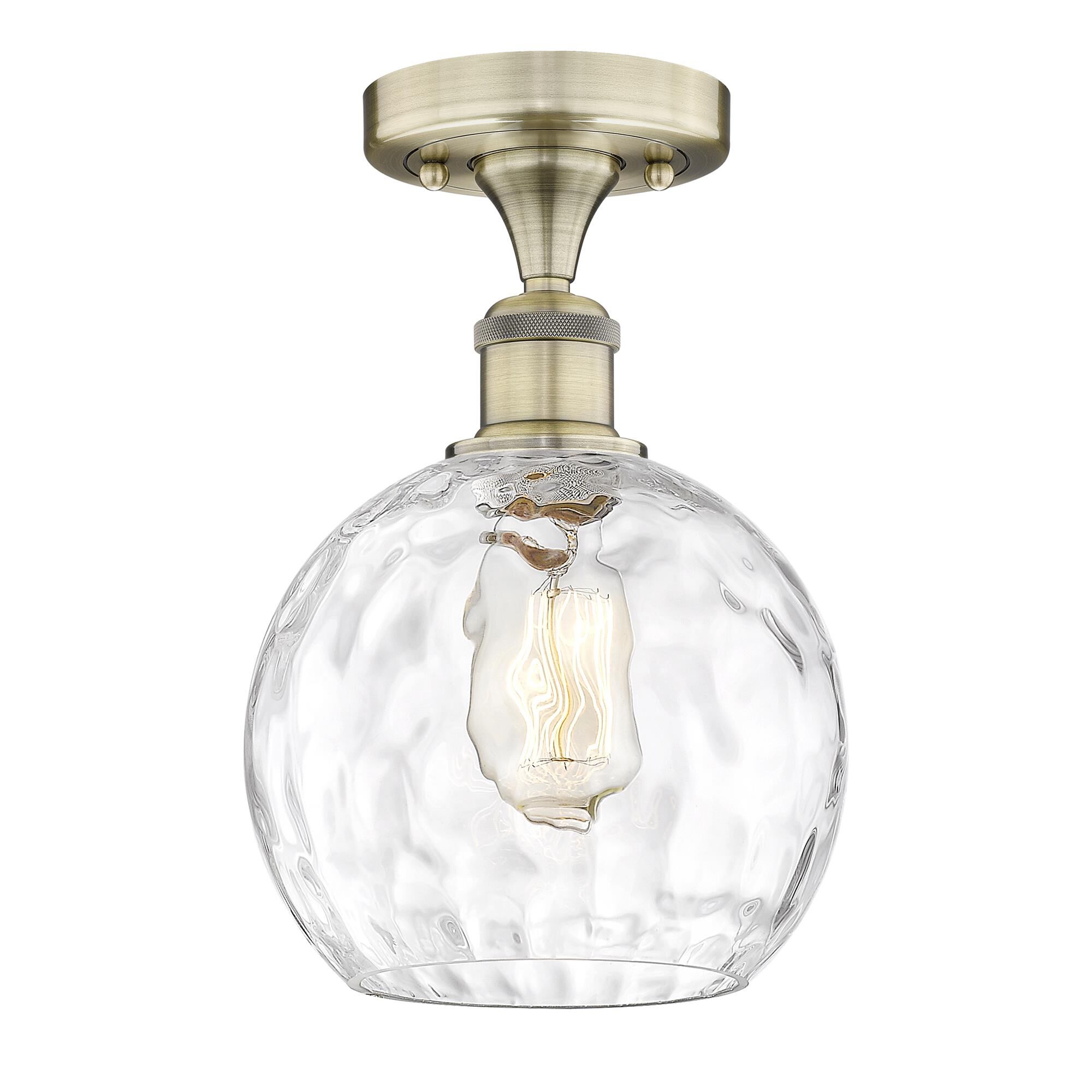 Shown in Antique Brass finish and Clear Water Glass glass