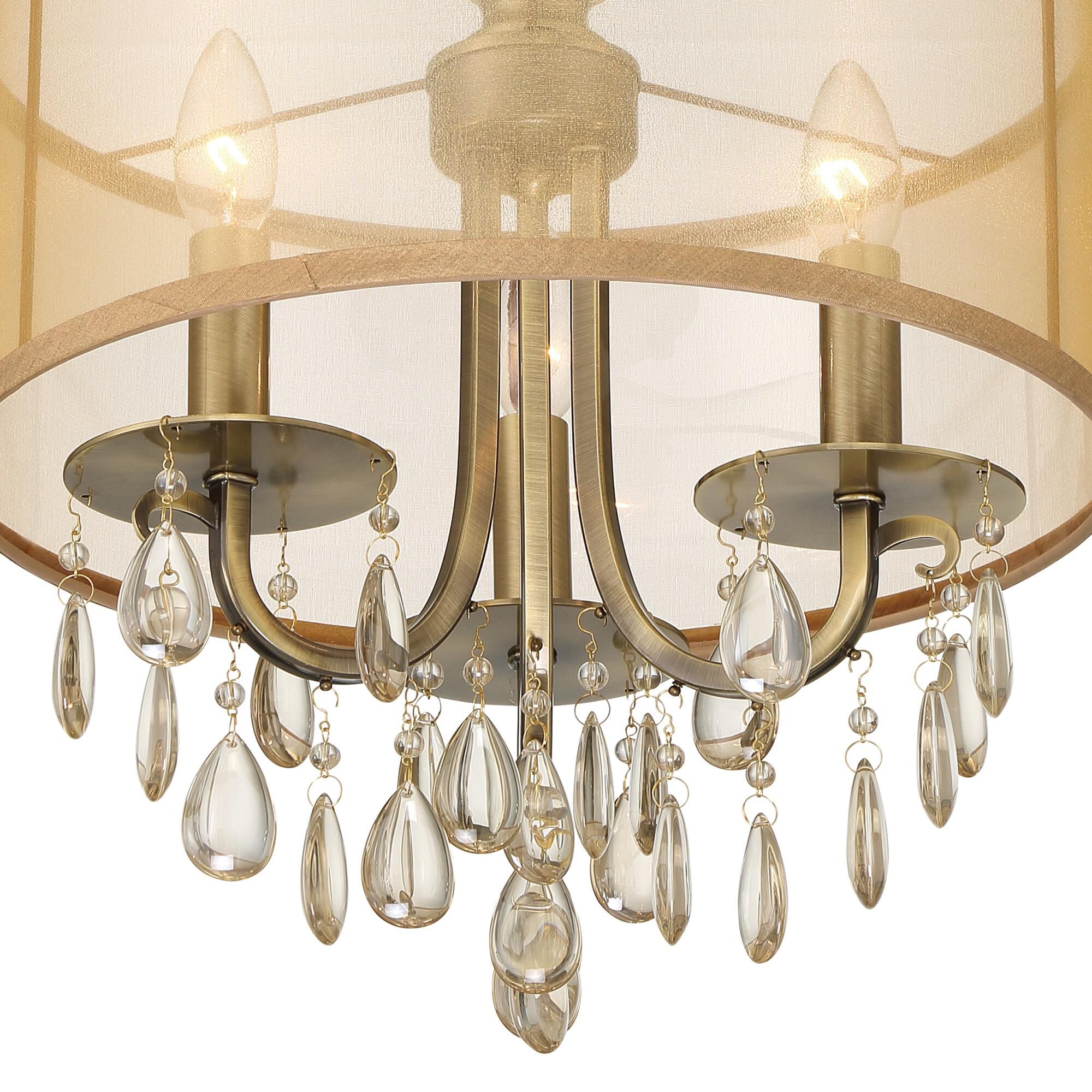 Shown in Antique Brass finish and Etruscan Teardrop Almond crystal and Silk glass and Translucent Gold shade