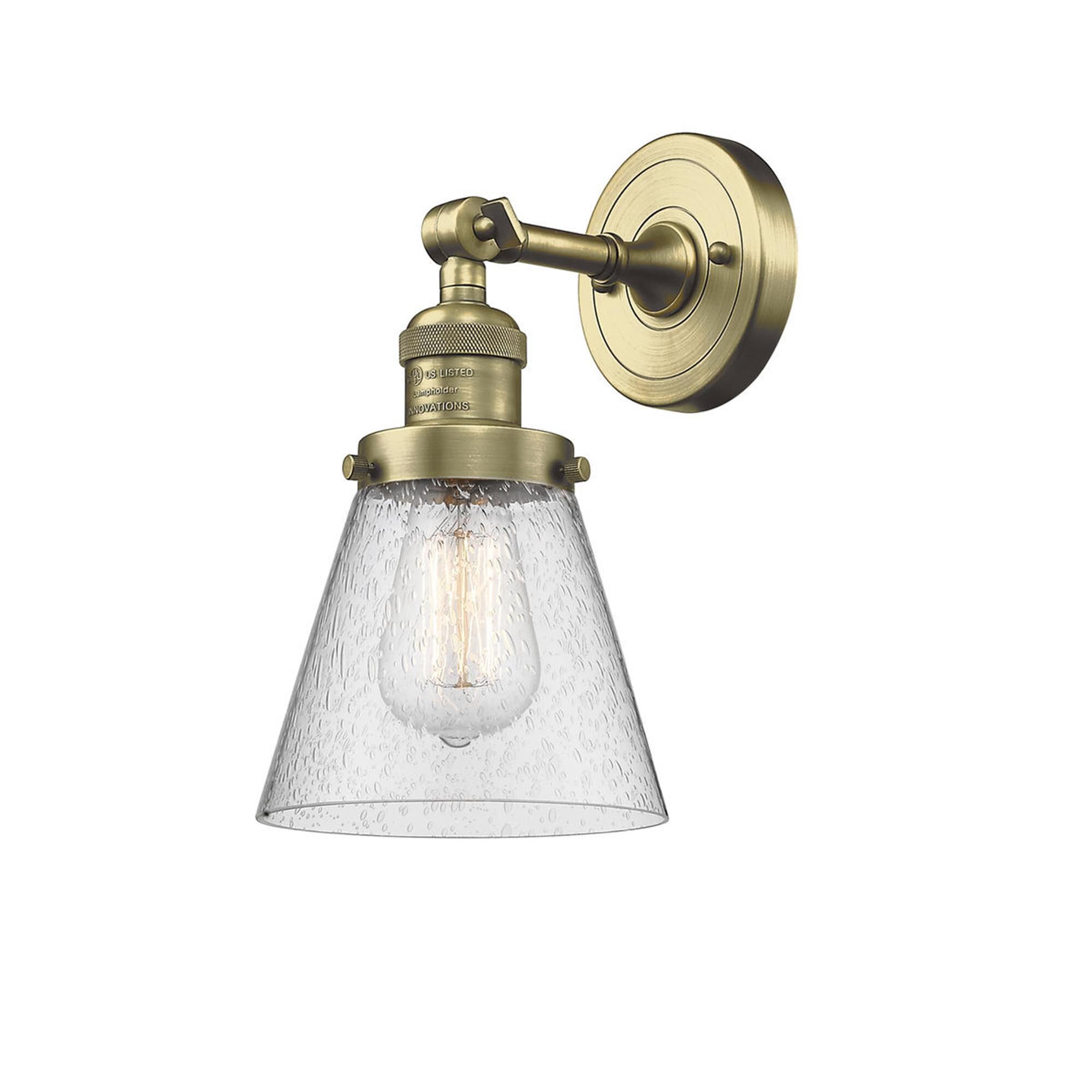 Shown in Antique Brass finish and Seedy glass