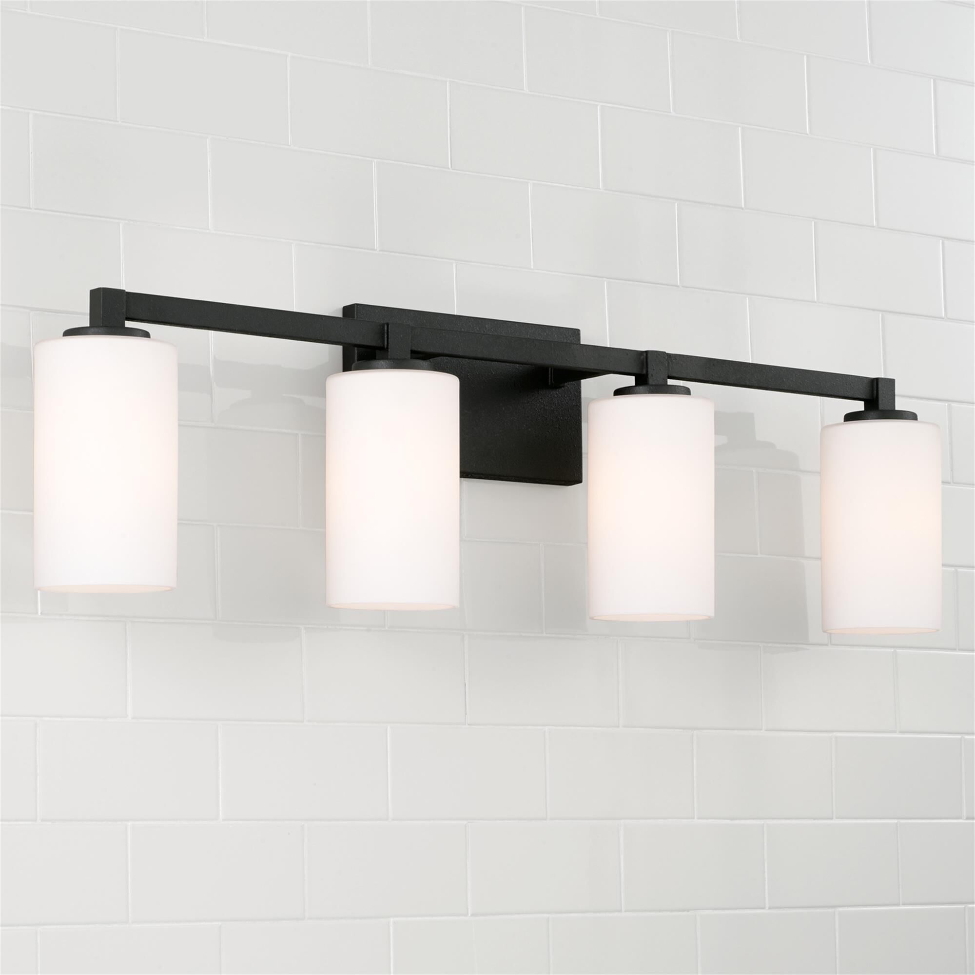 Shown in Black Iron finish and Soft White glass