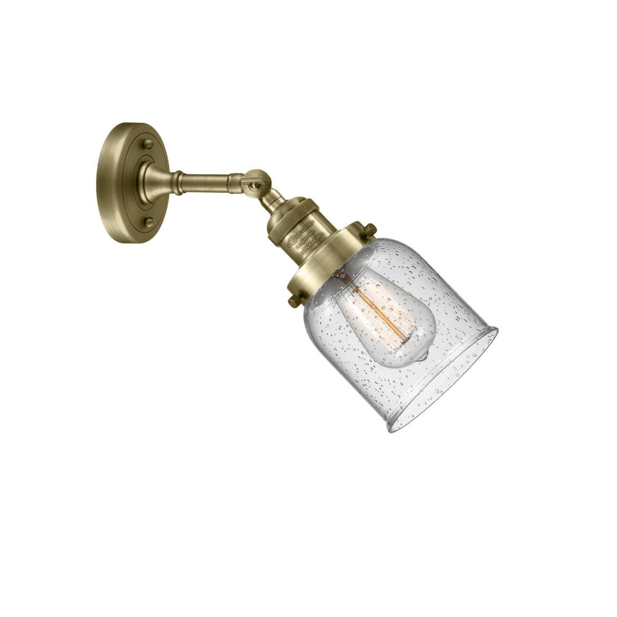 Shown in Antique Brass finish and Seedy glass and None accent