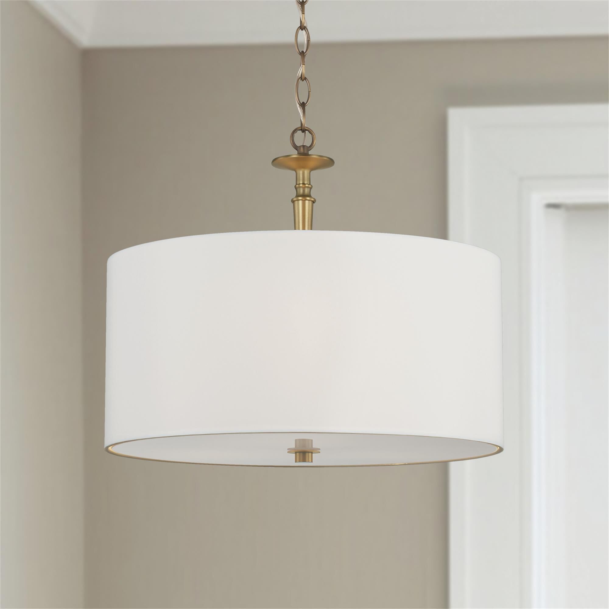 Shown in Aged Brass finish and White Fabric shade