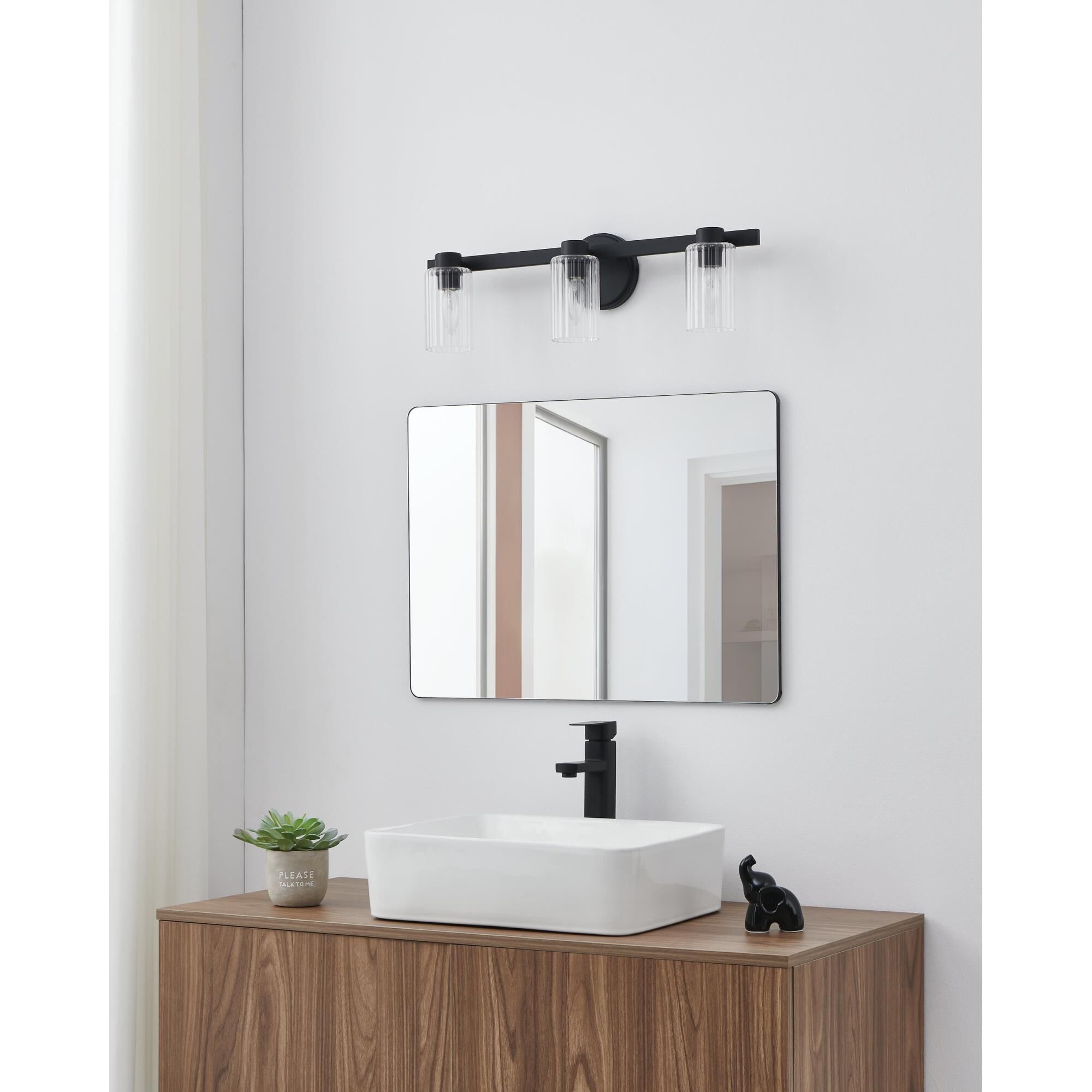 Shown in Matte Black finish and Clear Ribbed glass