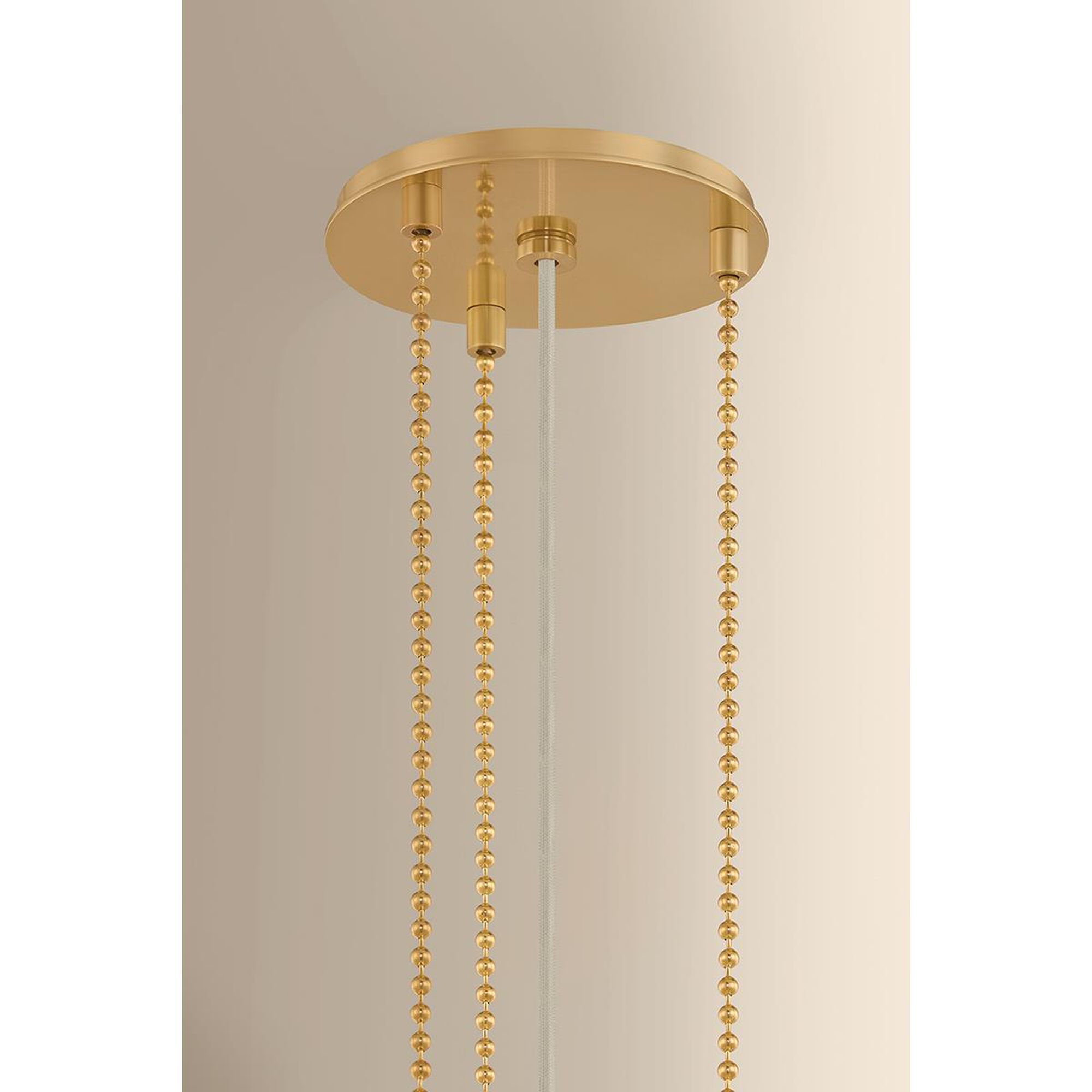 Shown in Aged Brass finish and Gathered Printed Cotton shade