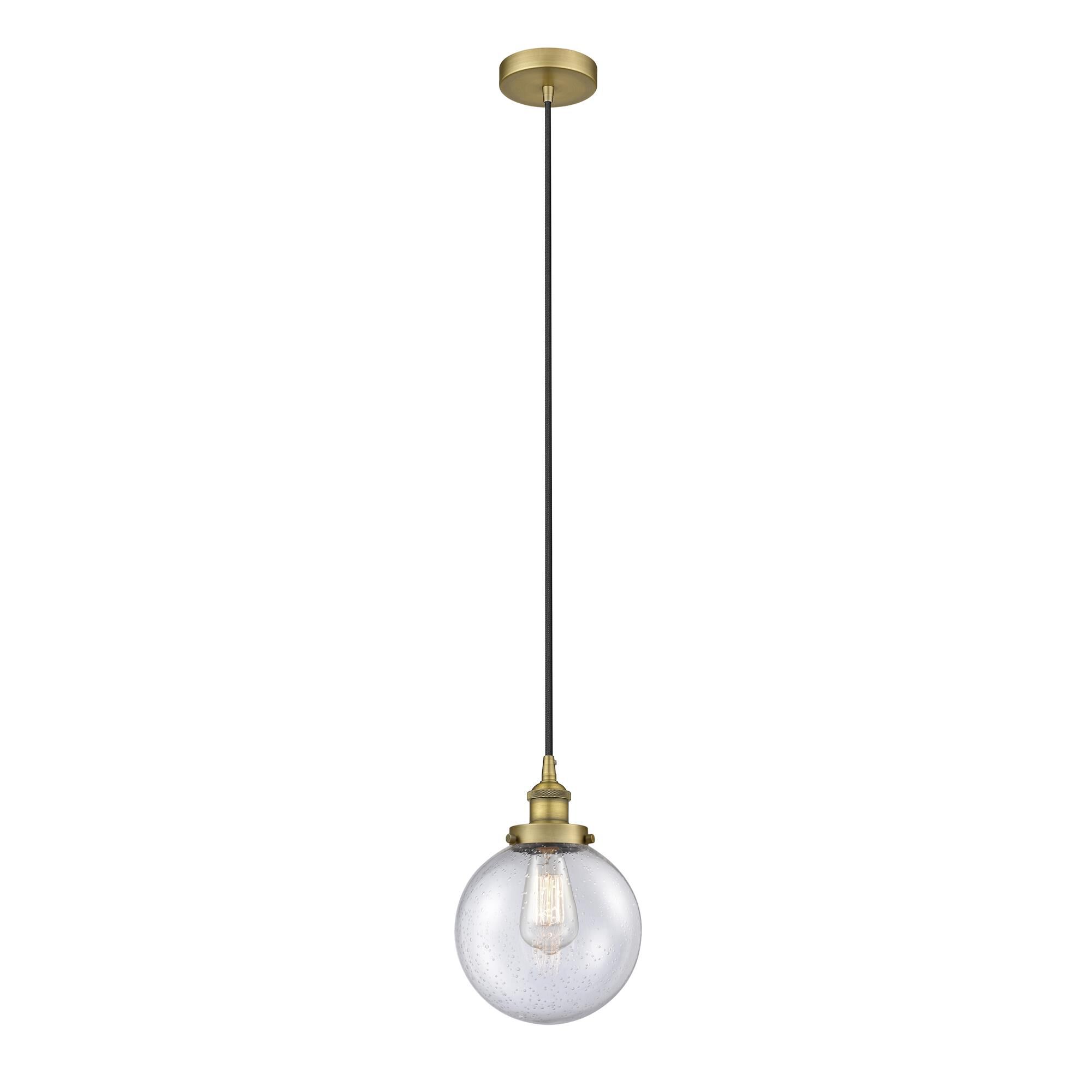 Shown in Brushed Brass finish and Seedy Beacon glass