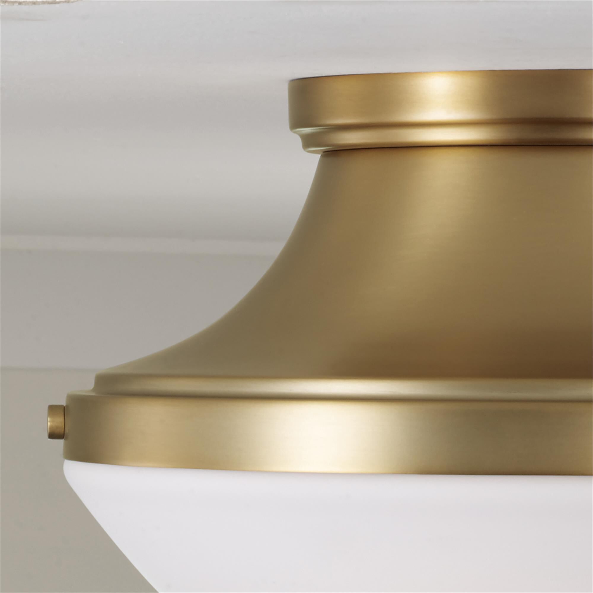 Shown in Aged Brass finish and Soft White glass