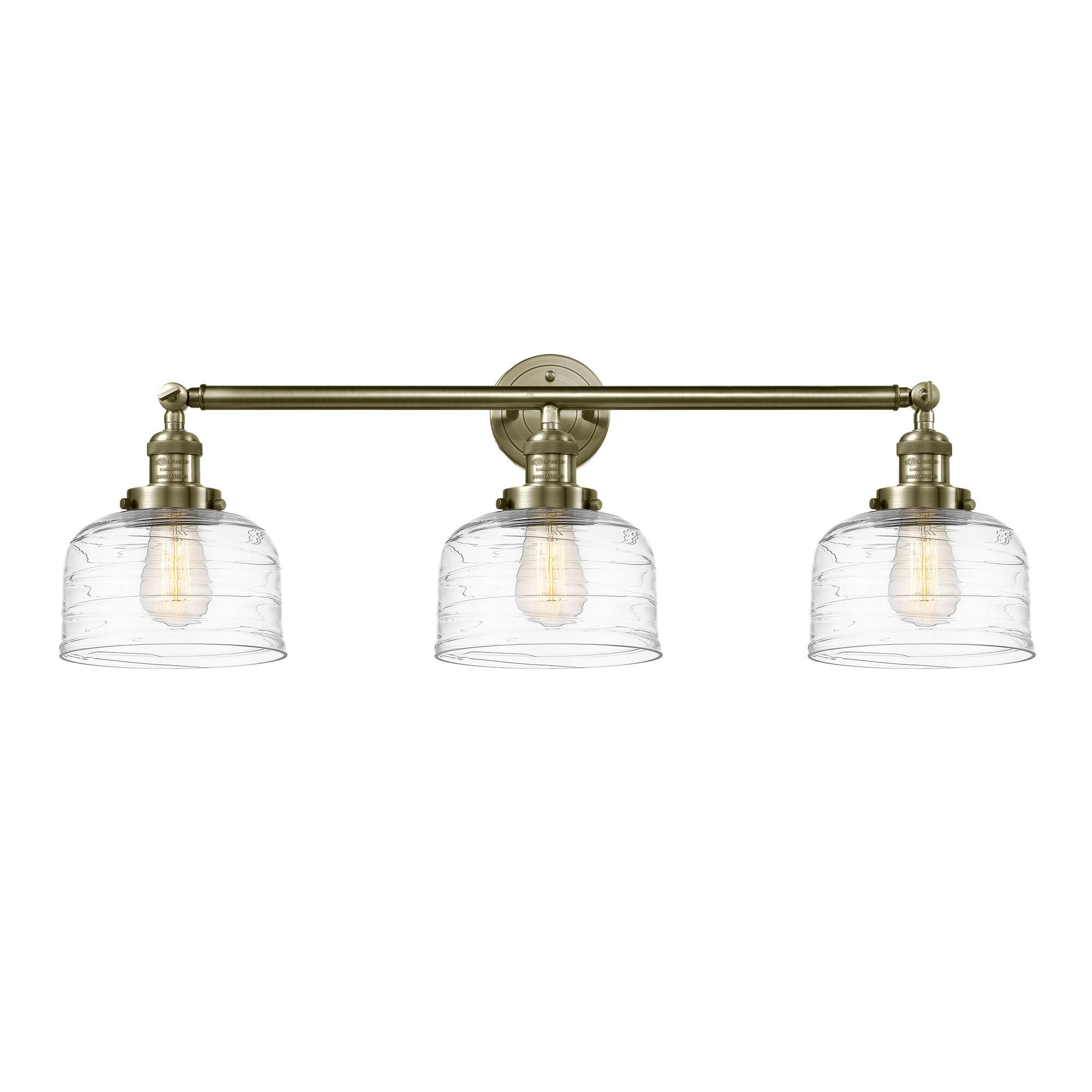 Shown in Antique Brass finish and Clear Deco Swirl Large Bell glass