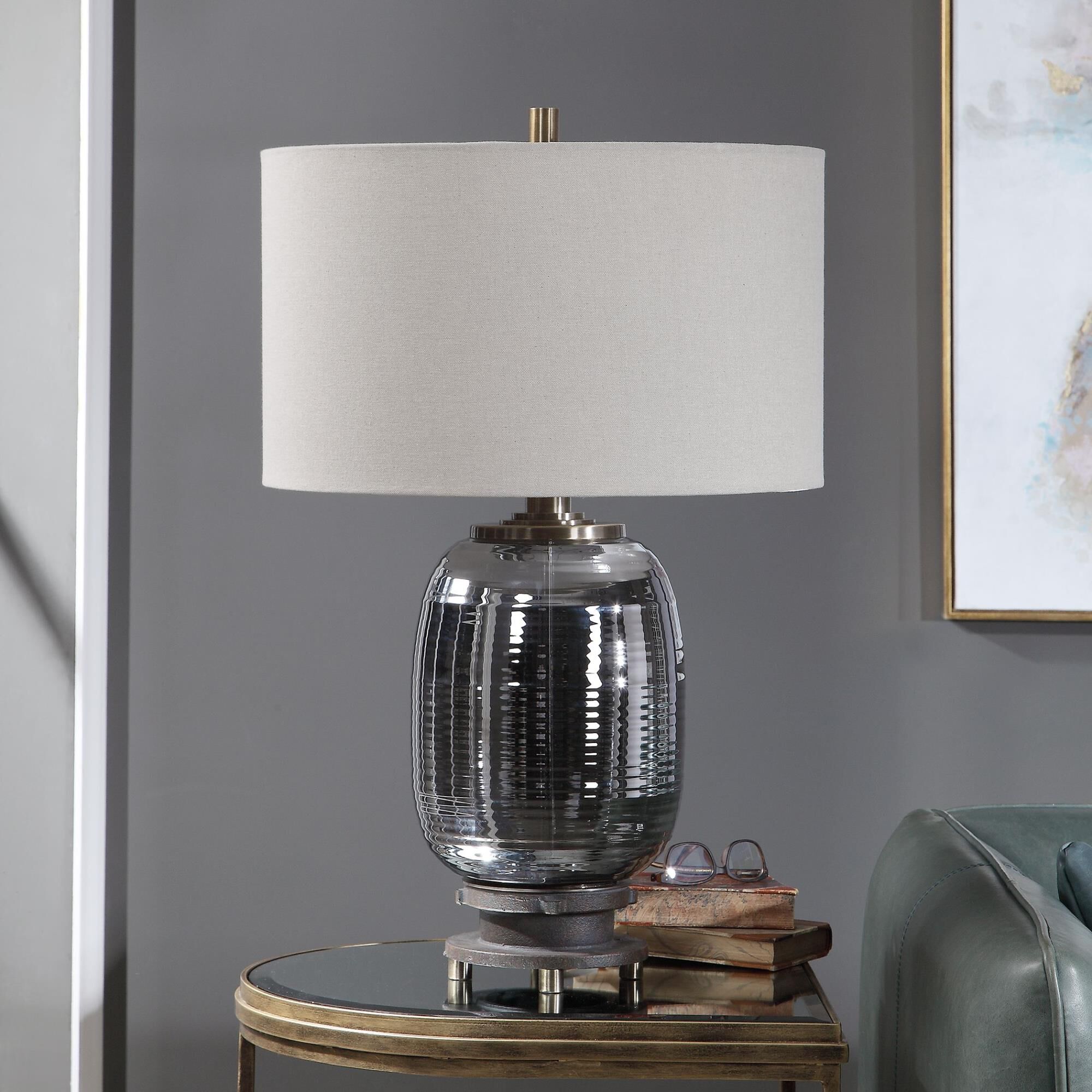 Shown in This Contemporary Table Lamp Has An Iridescent Amber Glass Base With A Wavy Textured Surface. Steel  finish and Round Hardback ,Rolled Edge shade