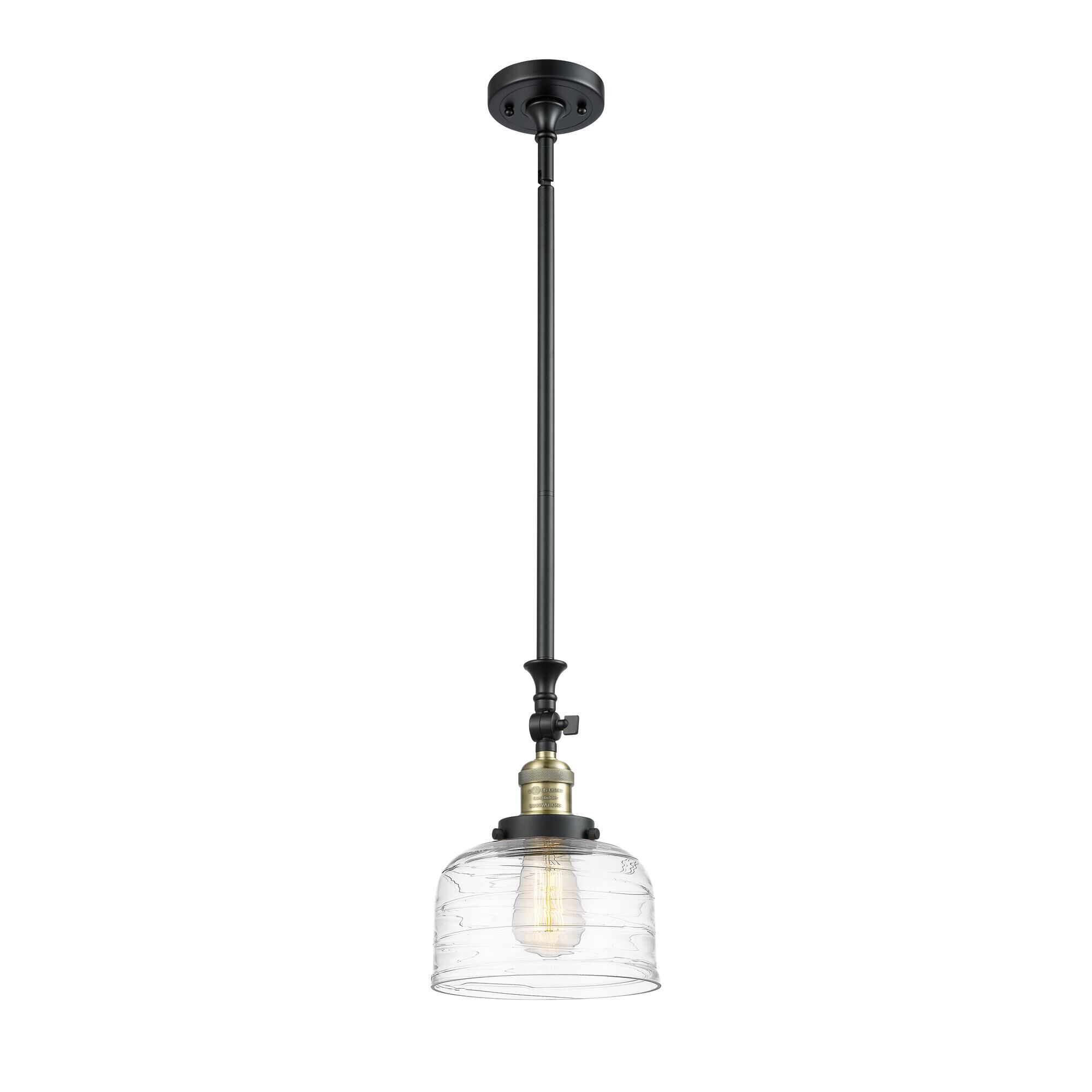 Shown in Black Antique Brass finish and Clear Deco Swirl Large Bell glass