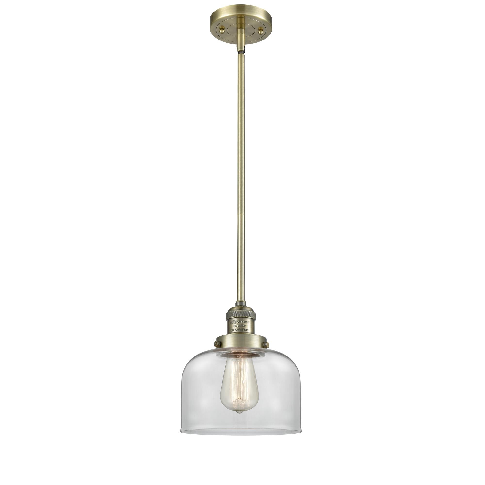 Shown in Antique Brass finish and Clear glass