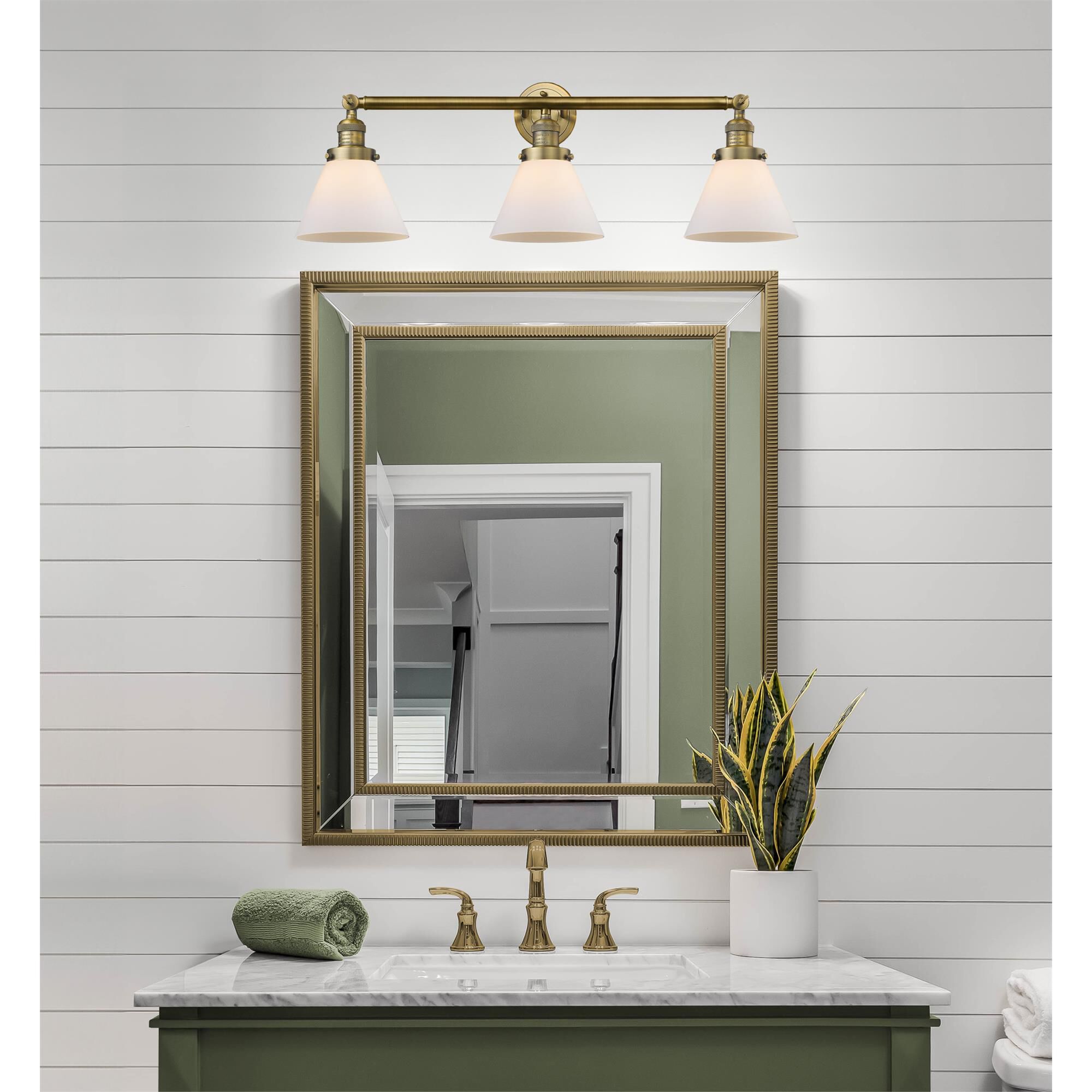 Shown in Brushed Brass finish and Matte White Cased glass