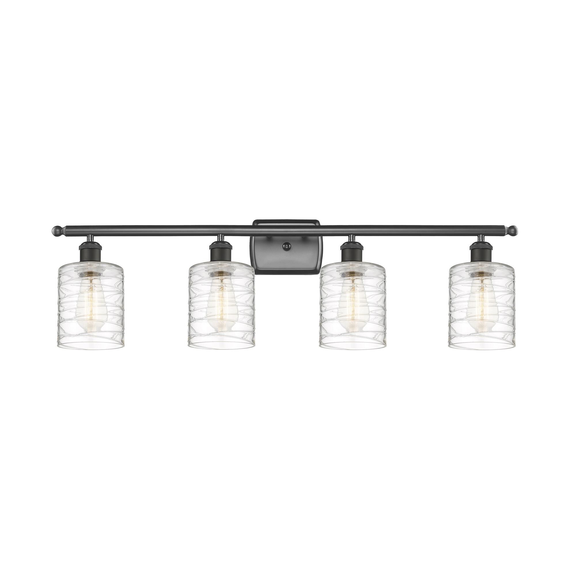 Shown in Oil Rubbed Bronze finish and Deco Swirl Cobbleskill glass