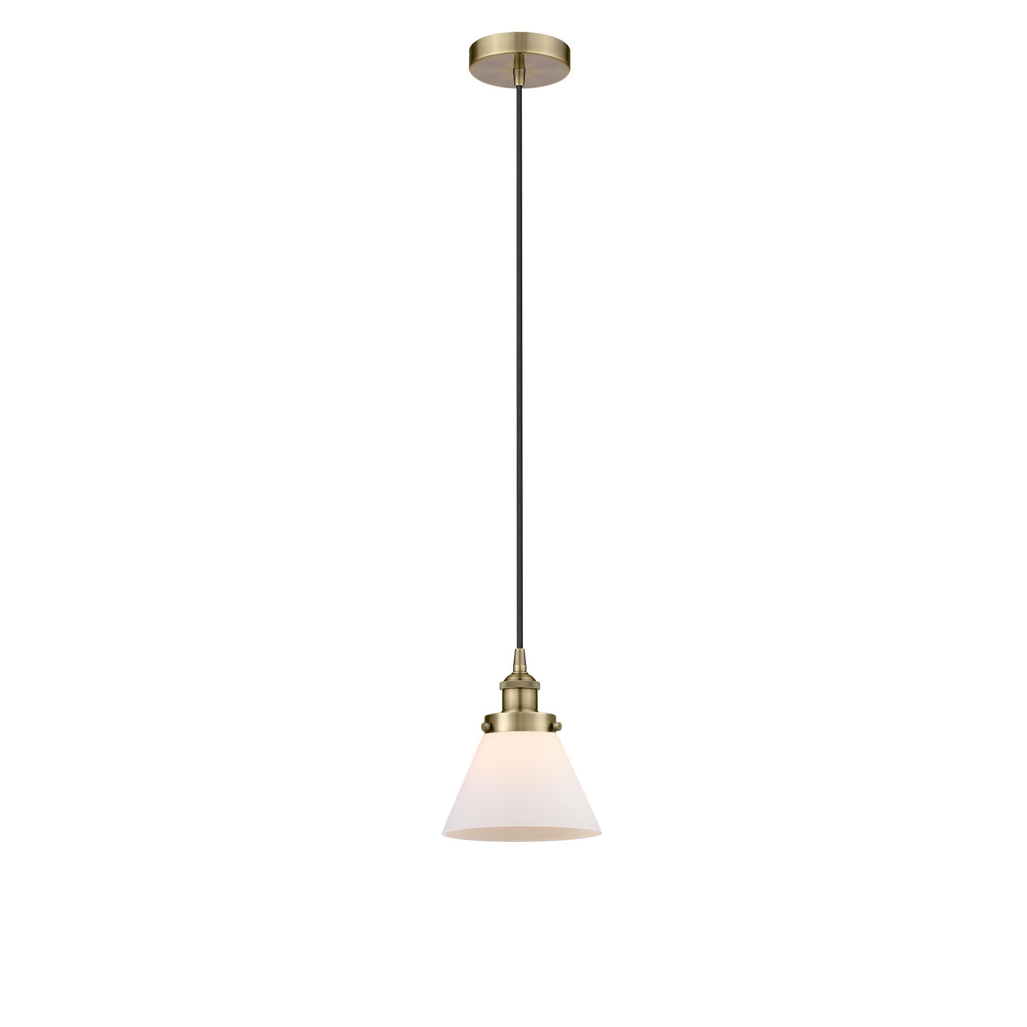 Shown in Antique Brass finish and Matte White glass