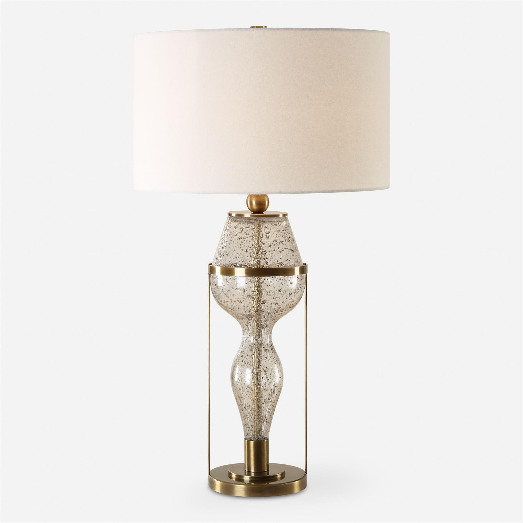 Shown in Featuring A Captivating Hourglass Silhouette, This Lamp Features A Seeded Glass Base With Gray Fleck finish and Round Hardback Drum shade