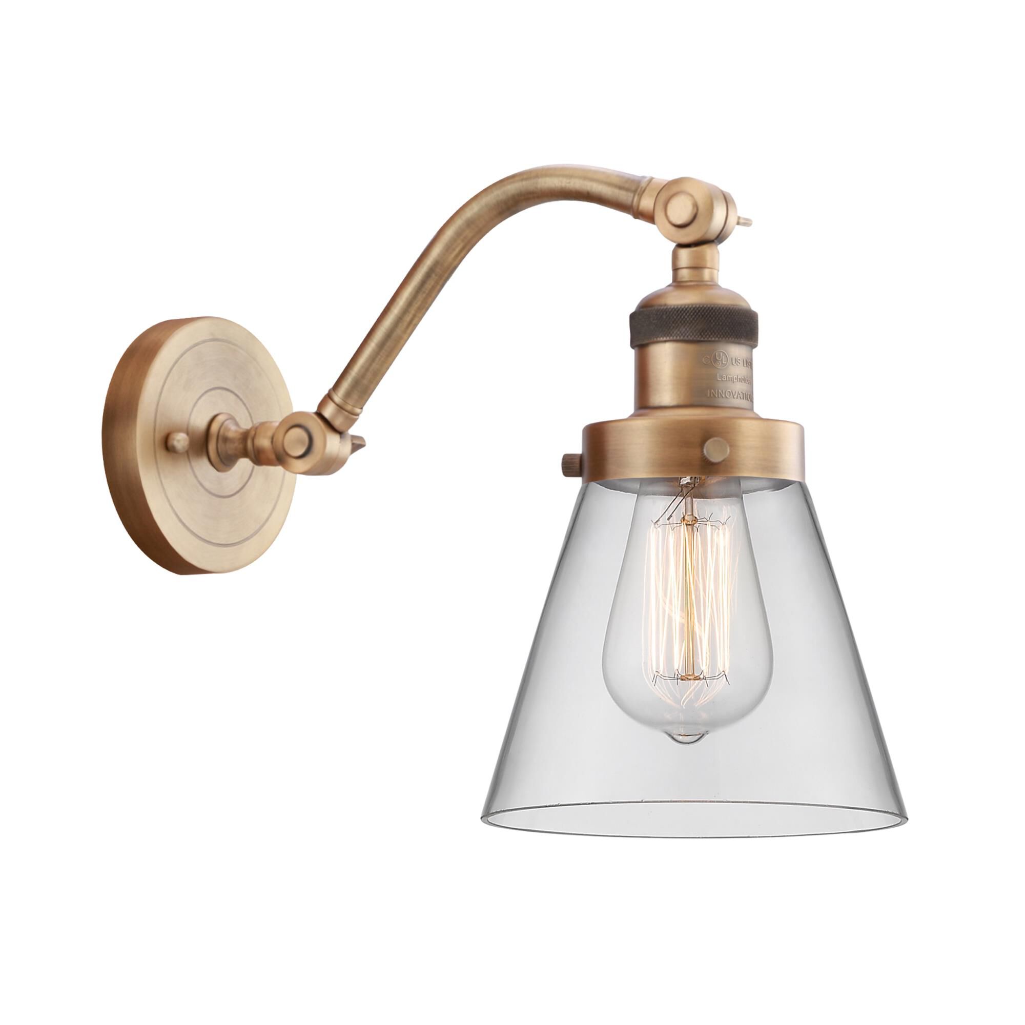 Shown in Brushed Brass finish and Clear Small Cone glass