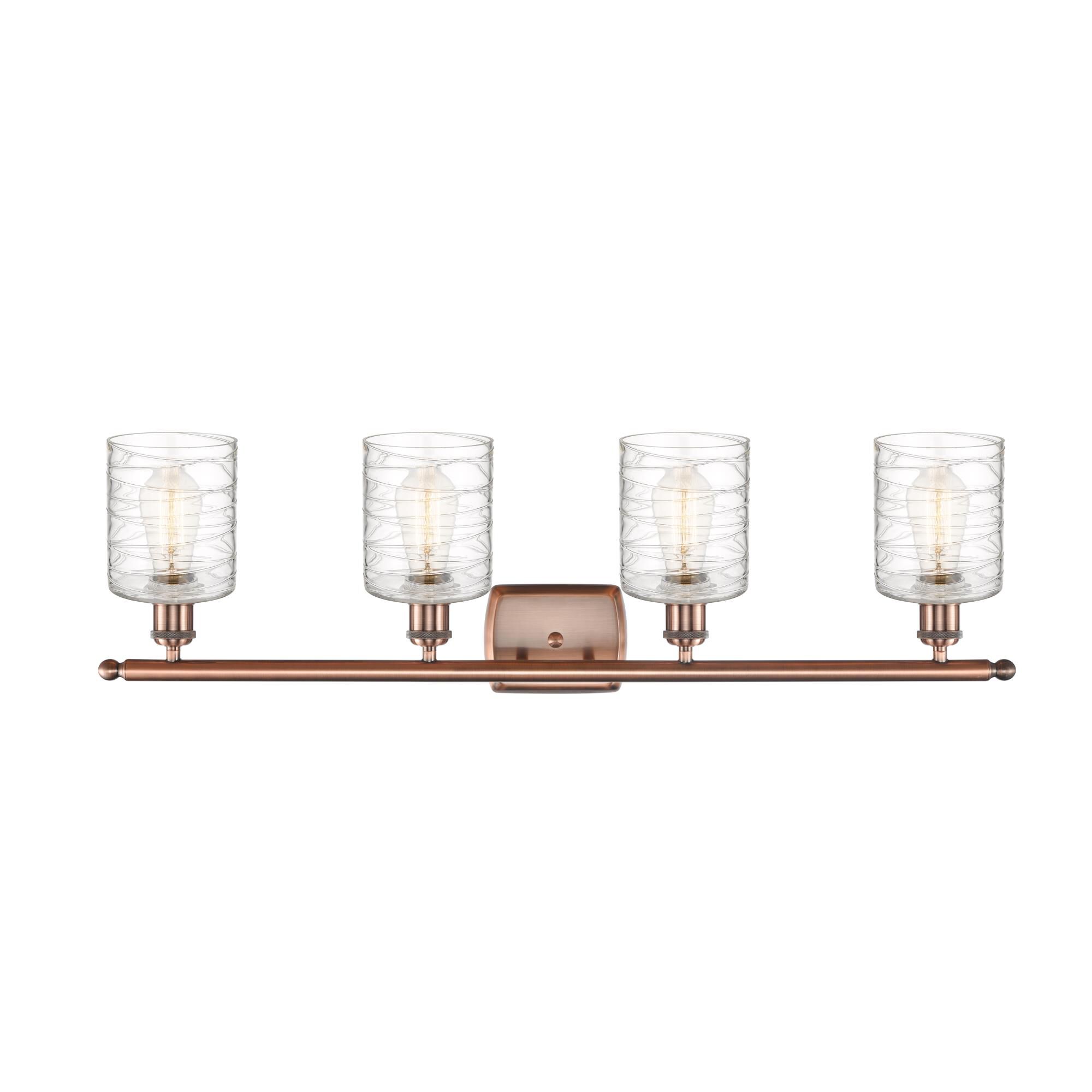 Shown in Antique Copper finish and Deco Swirl glass