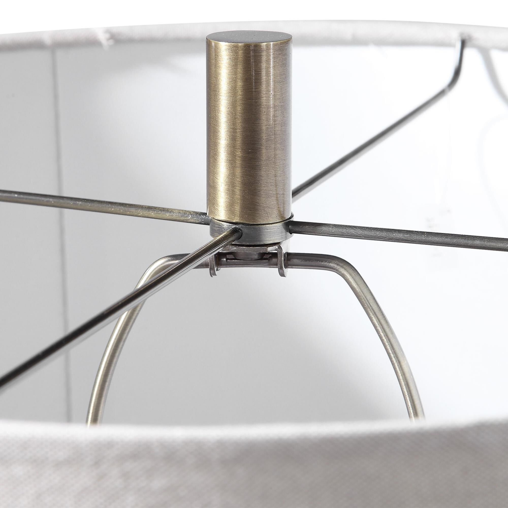 Shown in This Contemporary Table Lamp Has An Iridescent Amber Glass Base With A Wavy Textured Surface. Steel  finish and Round Hardback ,Rolled Edge shade