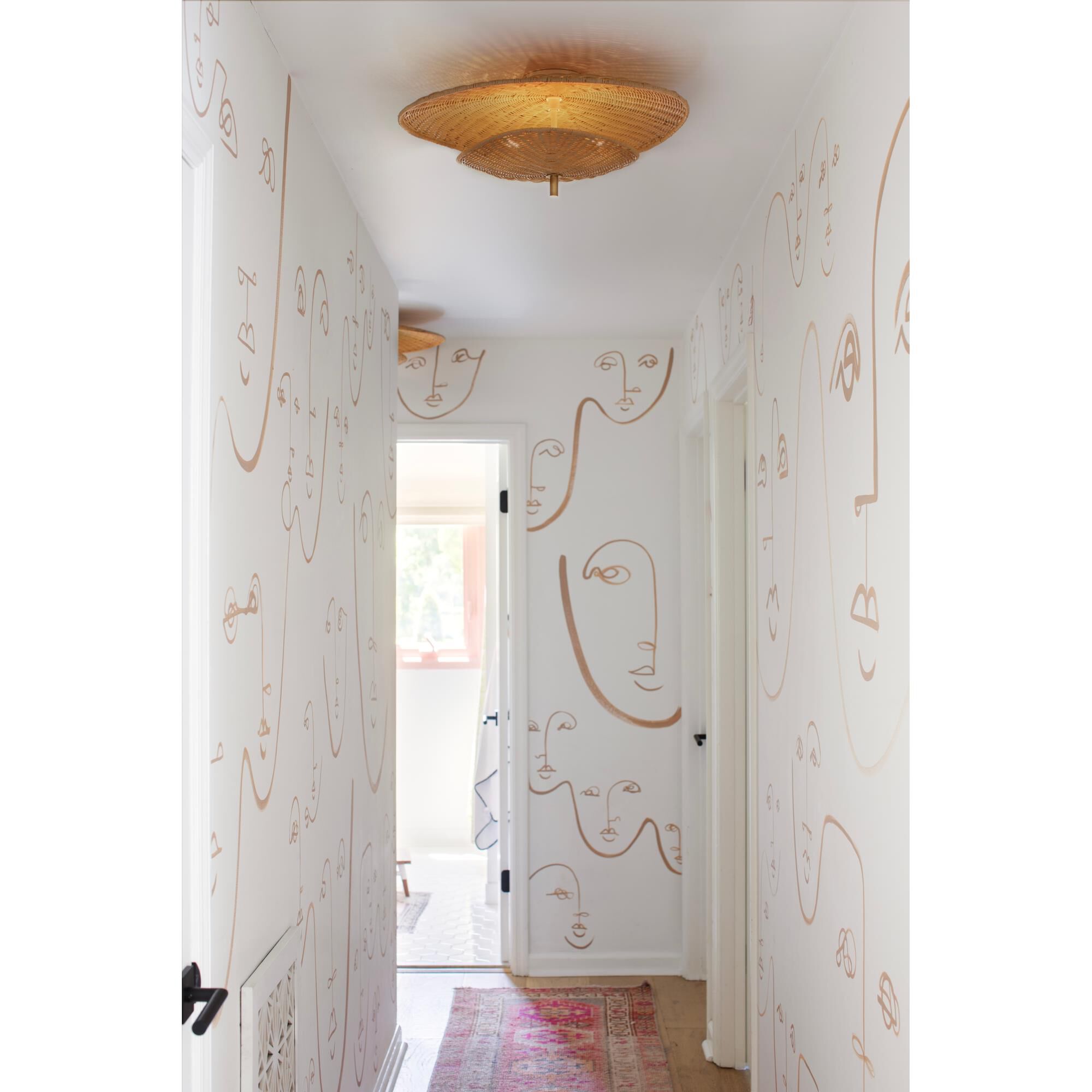 Shown in Aged Brass finish and Natural Woven shade