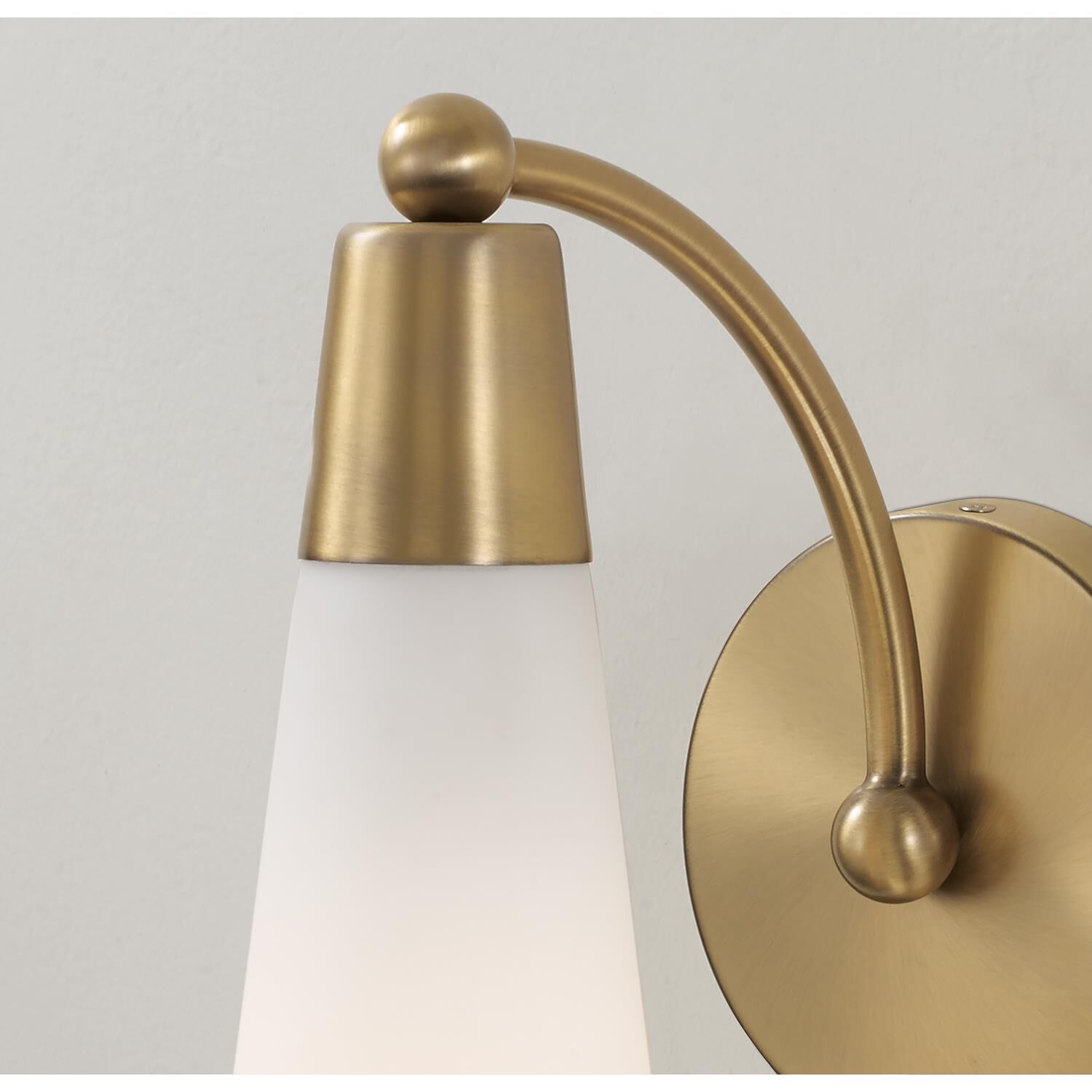 Shown in Aged Brass finish and Soft White glass