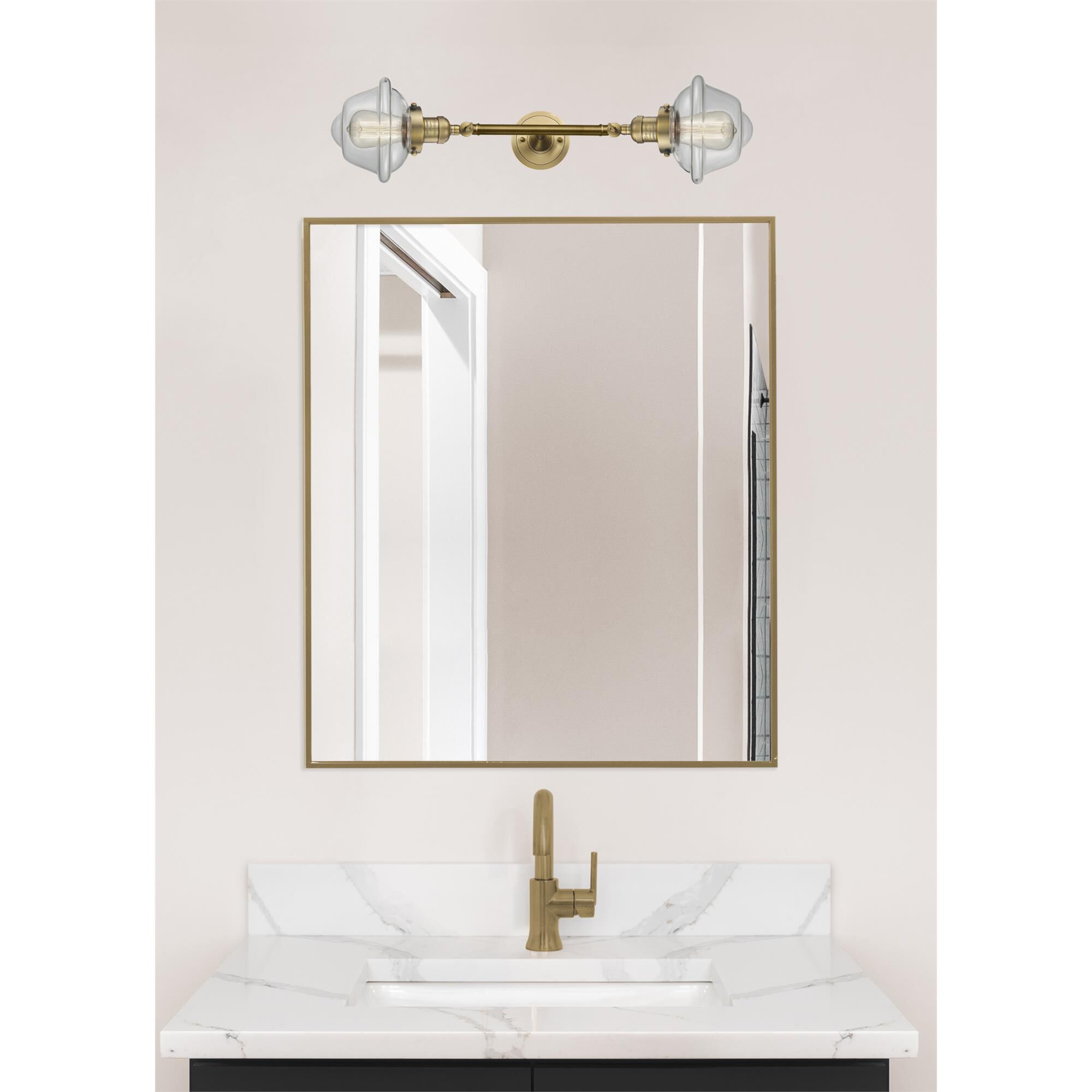 Shown in Brushed Brass finish and Clear glass