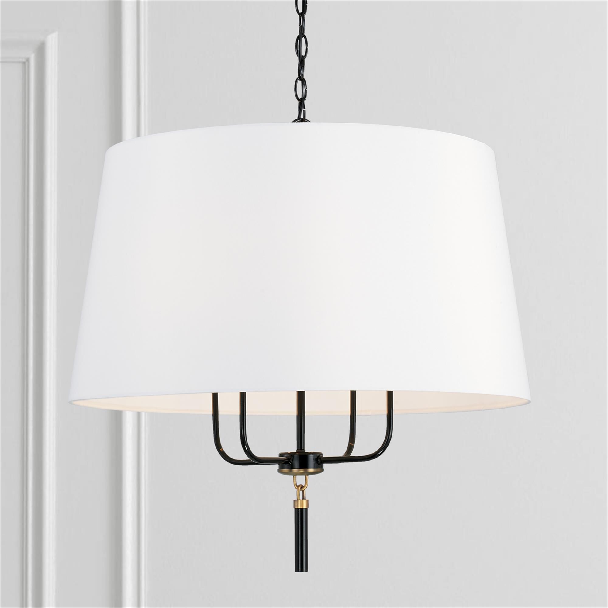 Shown in Glossy Black And Aged Brass finish and White Fabric shade