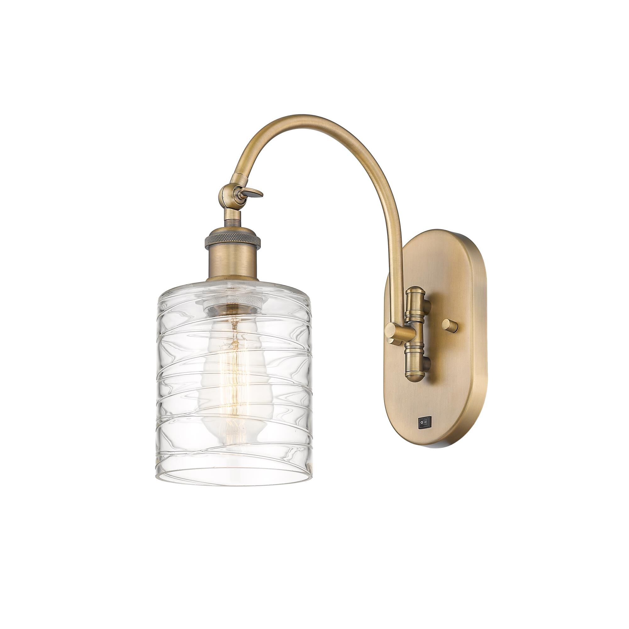 Shown in Brushed Brass finish and Deco Swirl glass