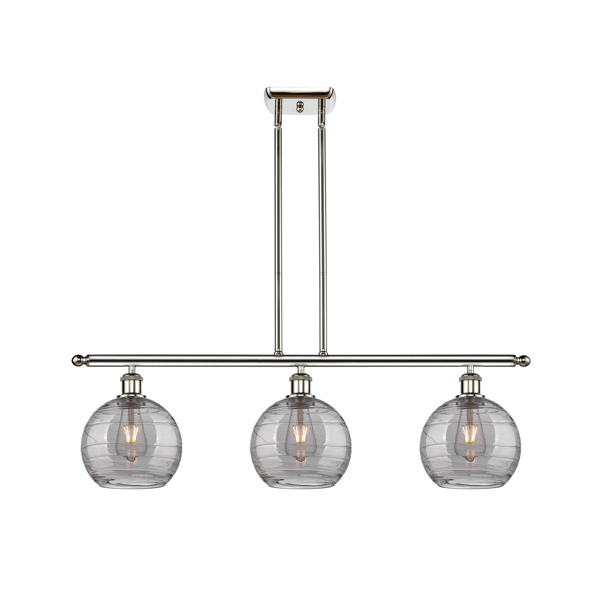 Shown in Polished Nickel finish and Light Smoke Deco Swirl glass