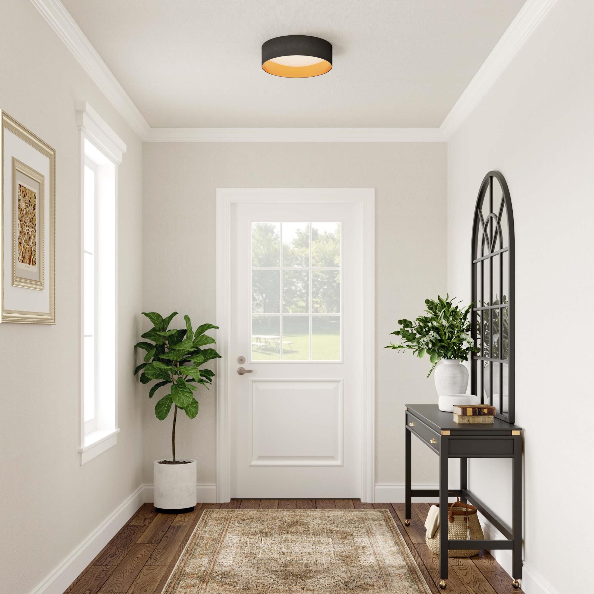 Shown in Burnished Gold finish and Black Fabric shade