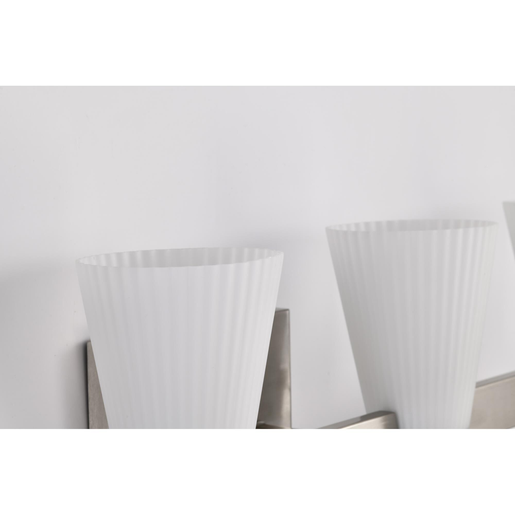 Shown in Brushed Nickel finish and Ribbed White glass