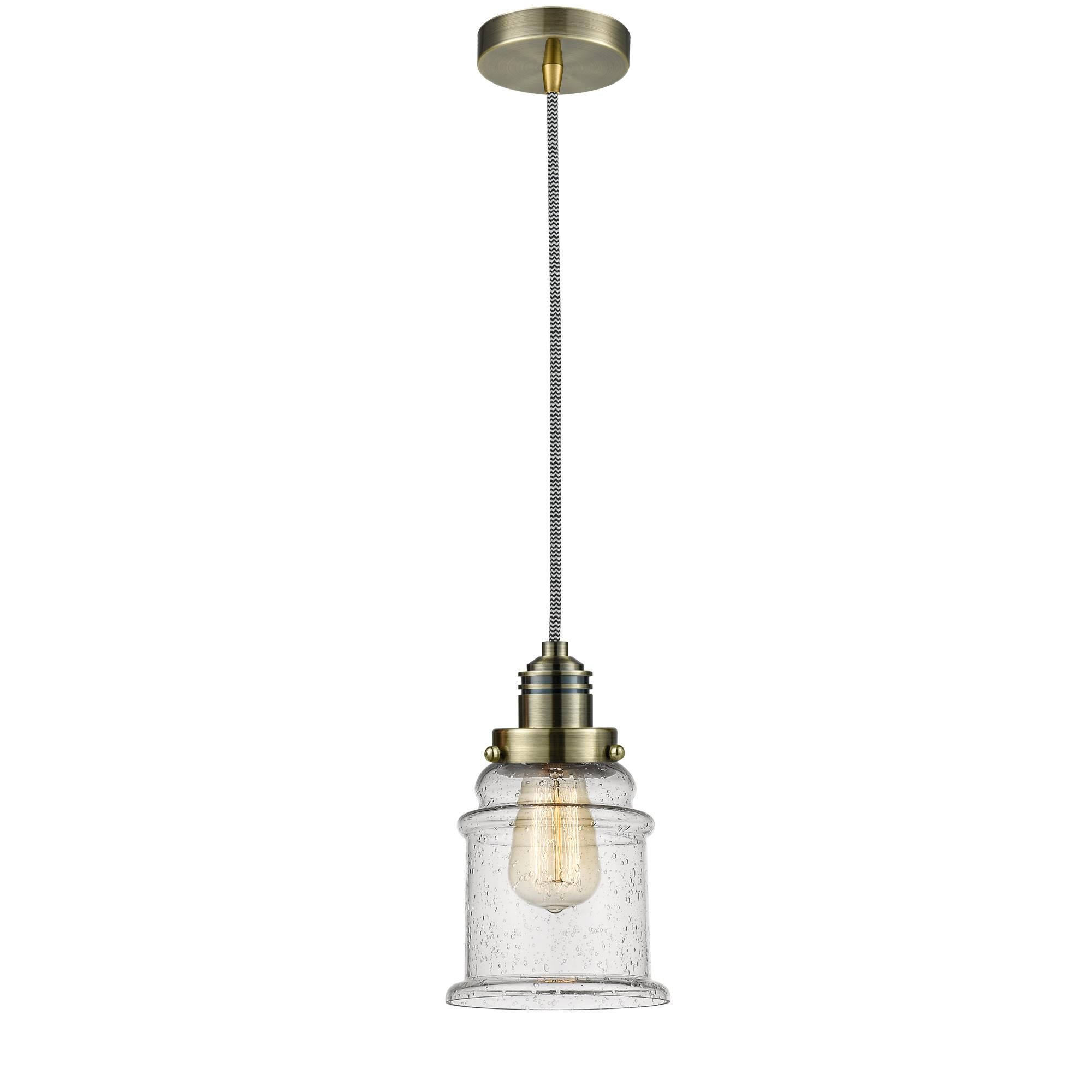 Shown in Antique Brass finish and Bell glass and Glass shade and Antique Brass Winchester Socket Cover accent