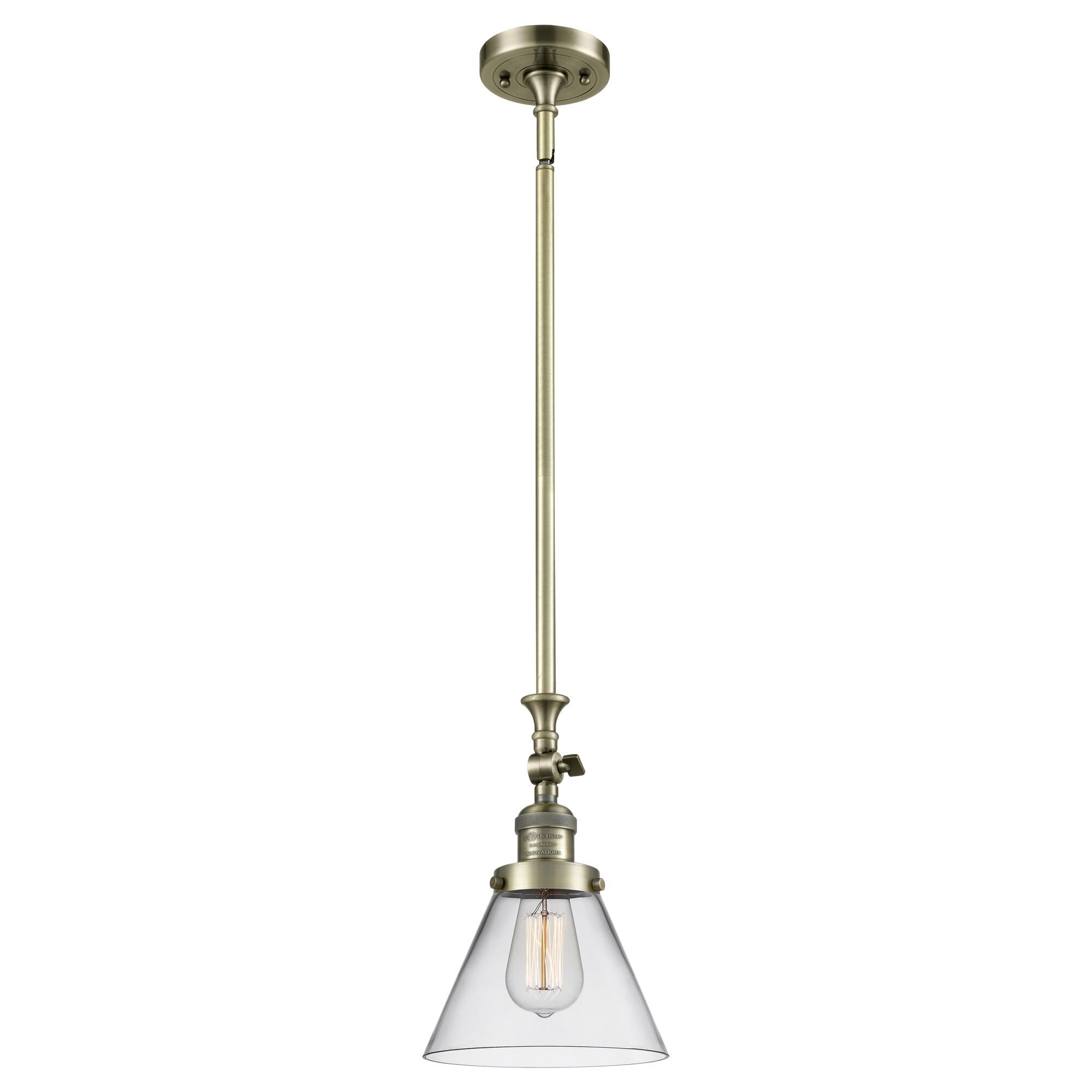 Shown in Antique Brass finish and Clear glass