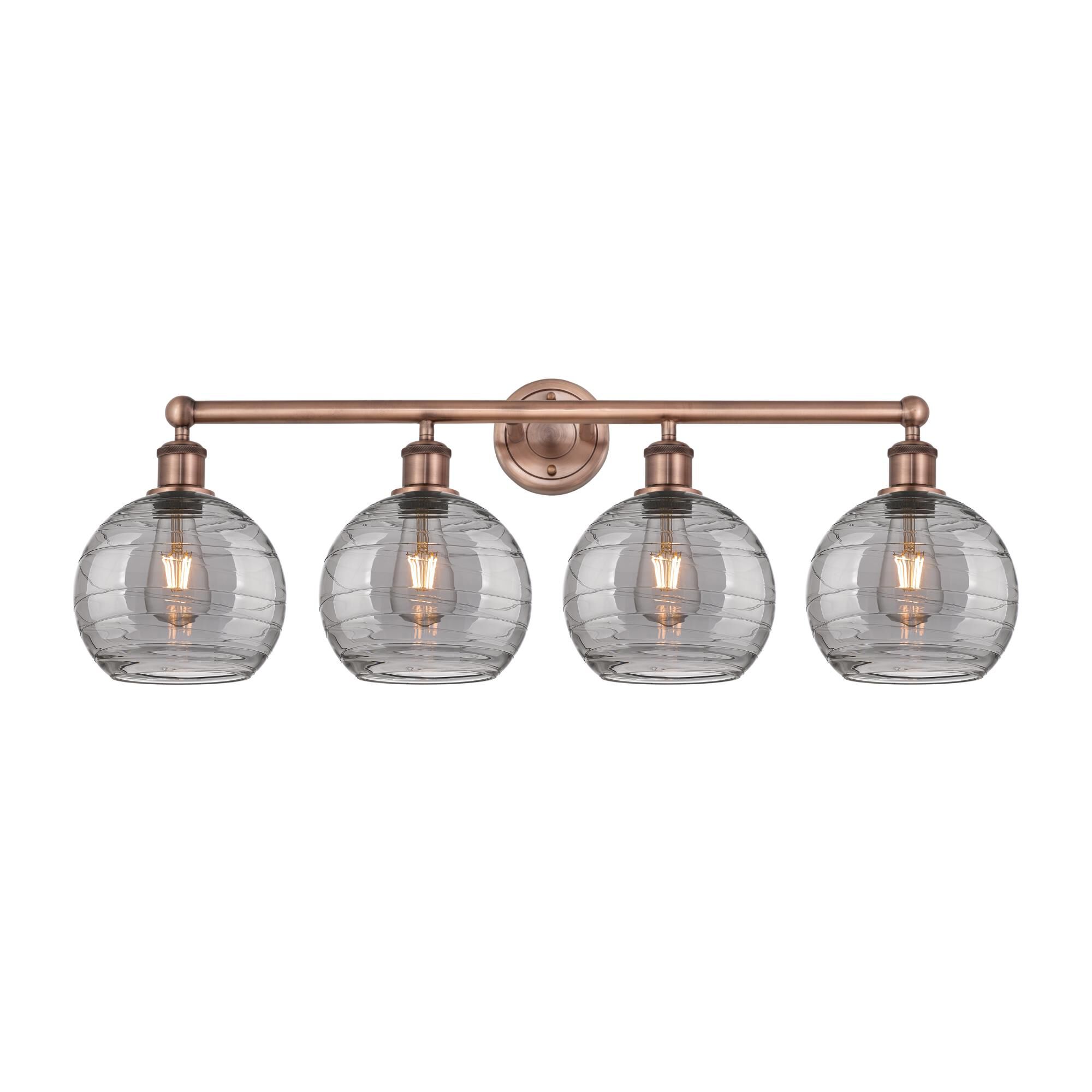 Shown in Antique Copper finish and Light Smoke Deco Swirl glass