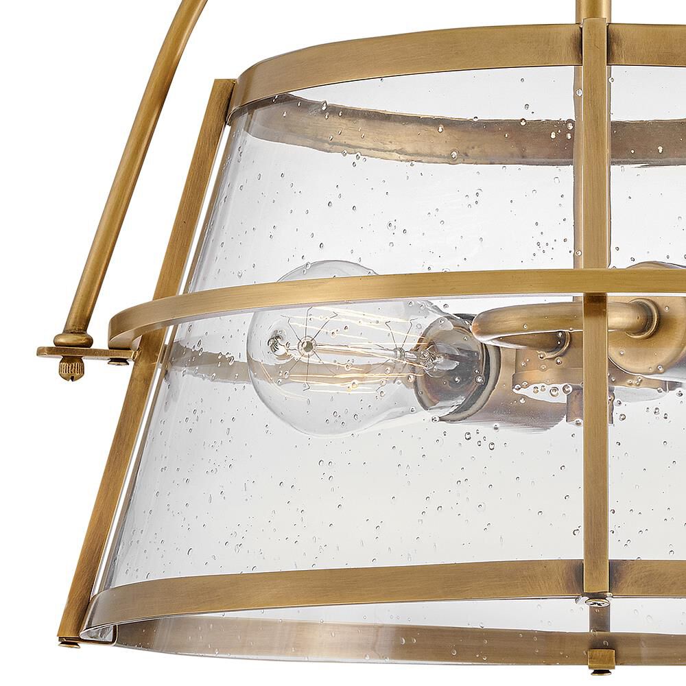 Shown in Heritage Brass finish and Clear Seedy glass