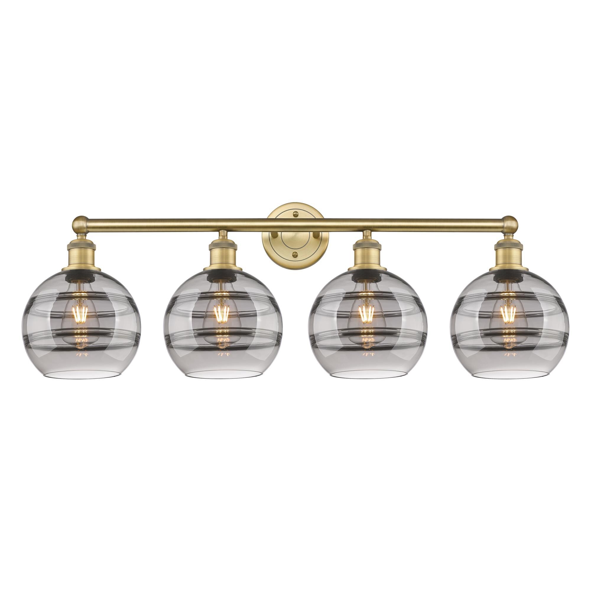 Shown in Brushed Brass finish and Light Smoke glass