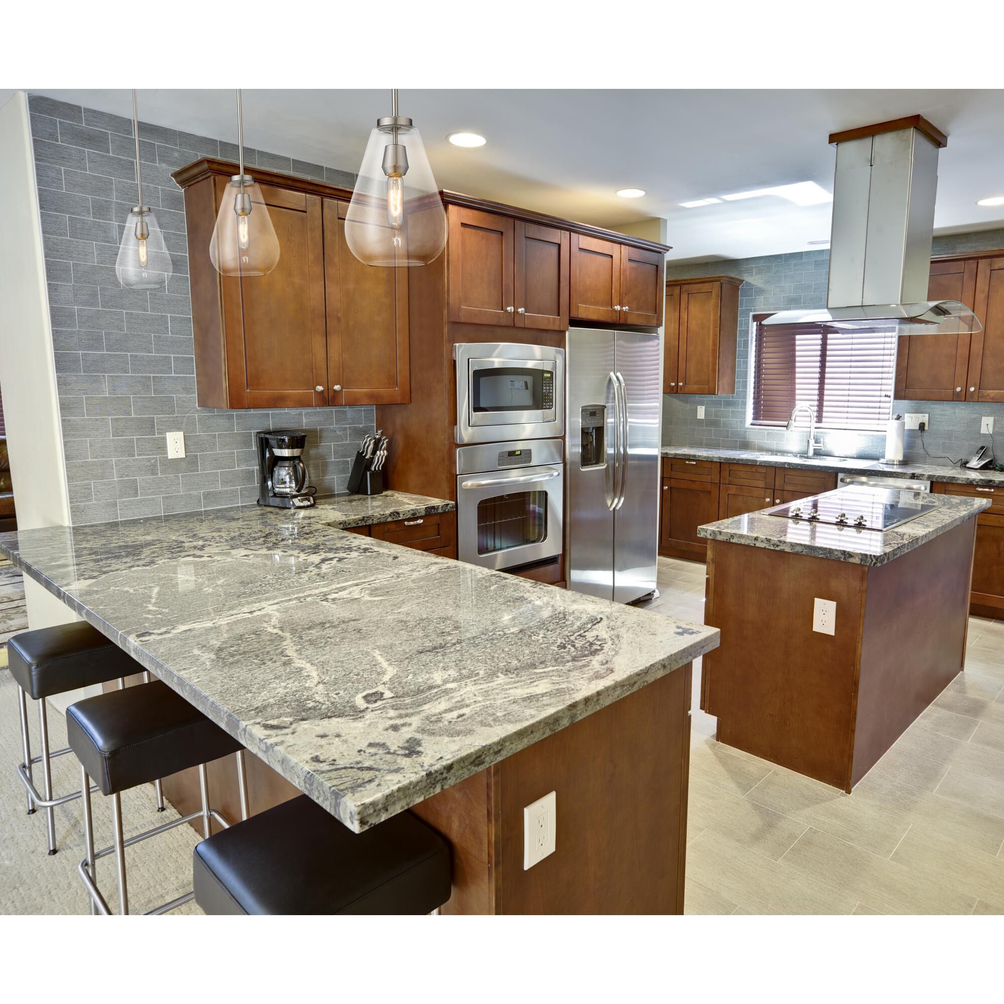 Shown in Brushed Nickel finish and Glass shade